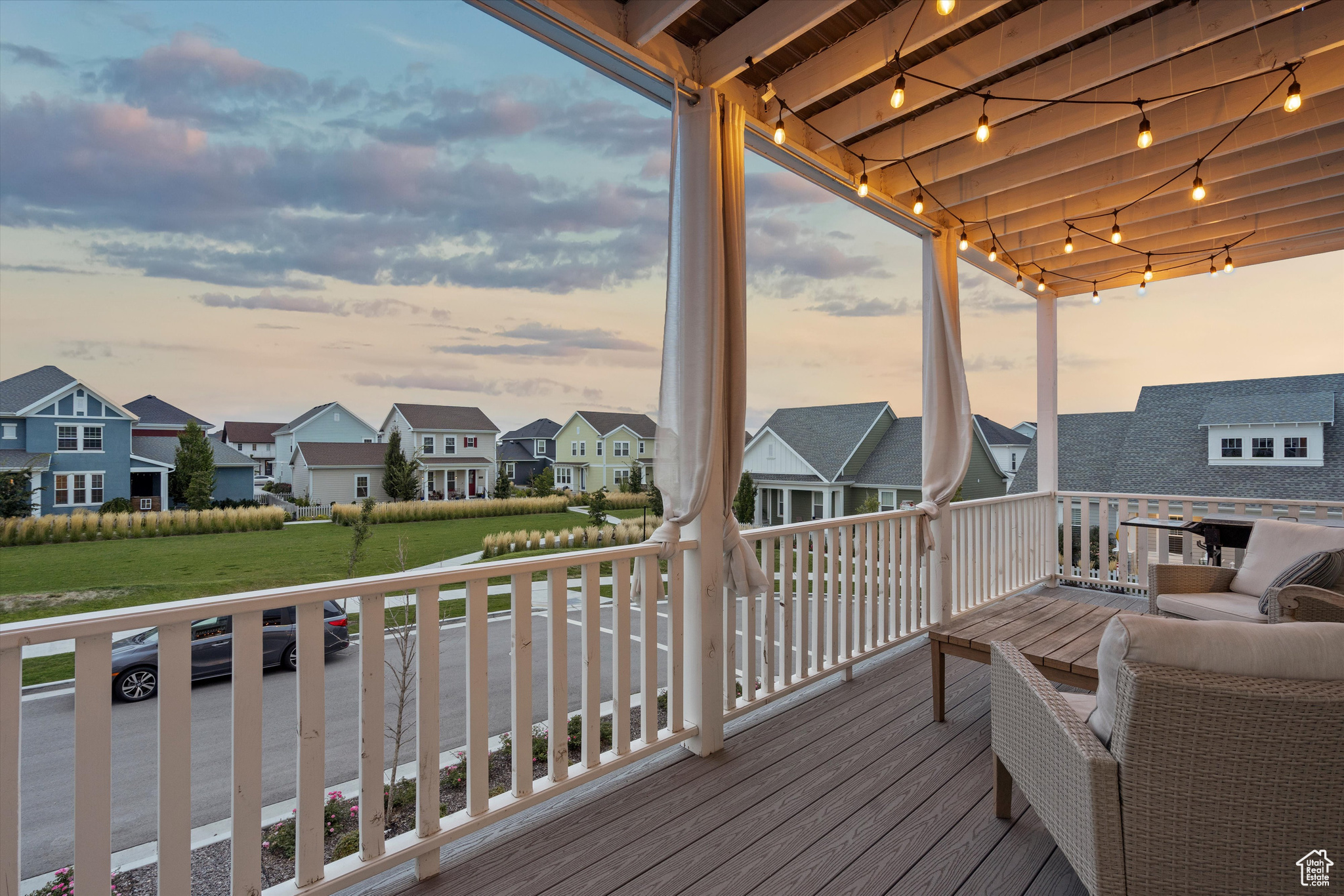 Deck at dusk featuring a yard