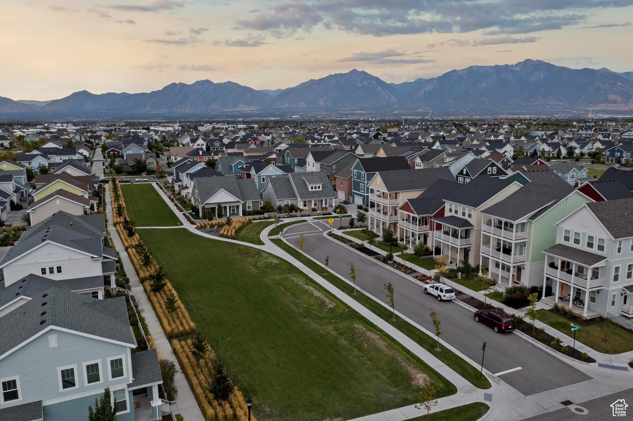 Aerial view at dusk featuring a mountain view