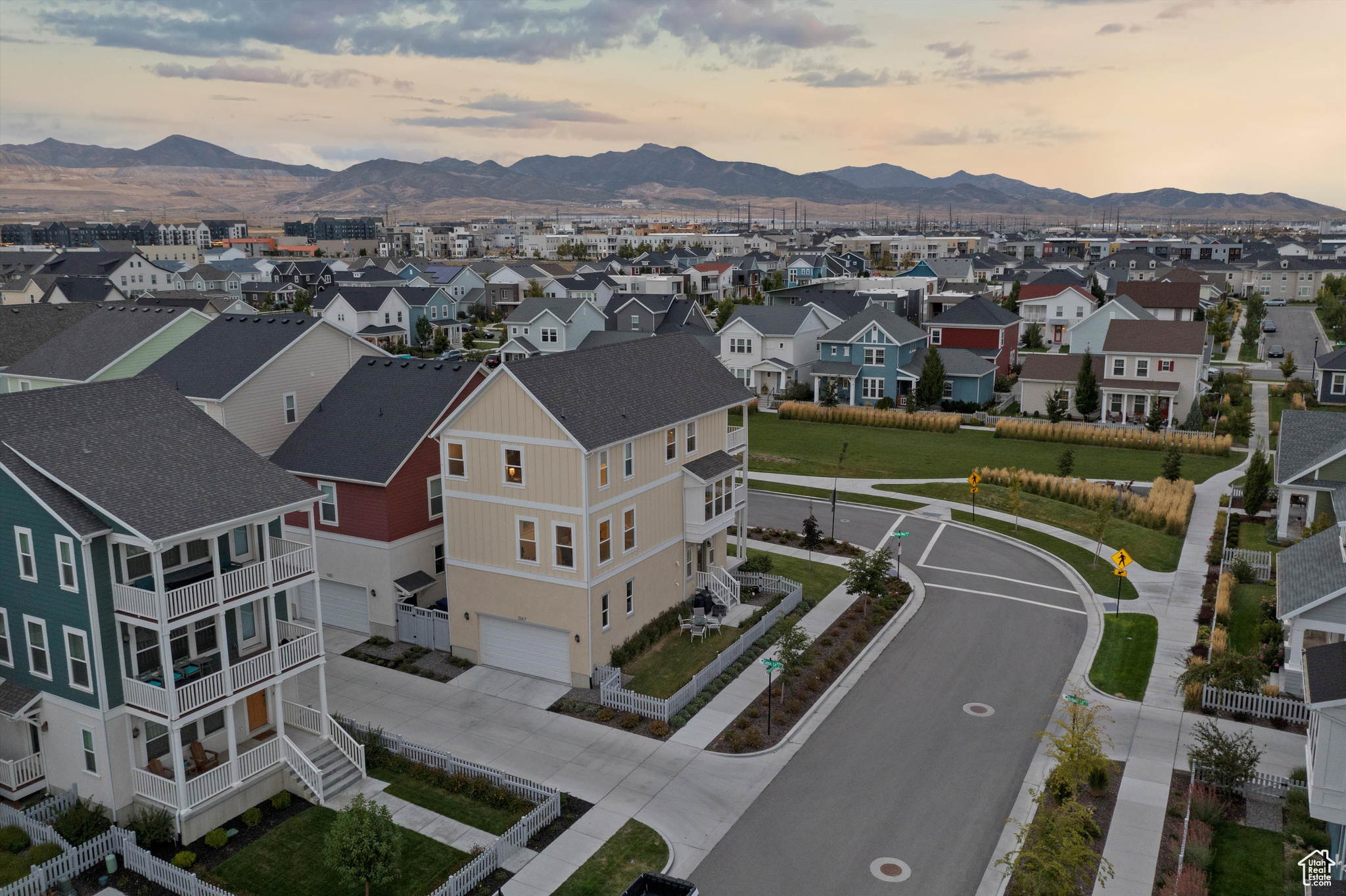 Aerial view at dusk featuring a mountain view