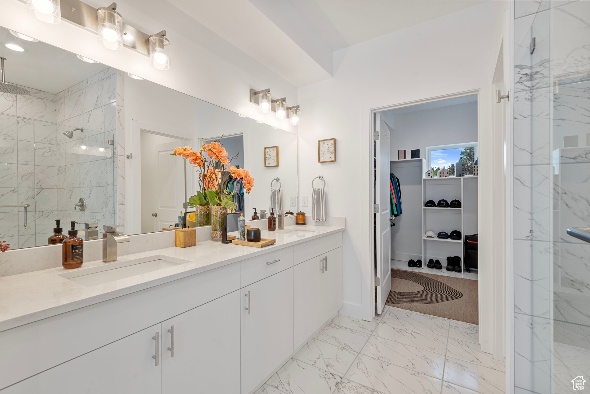 Bathroom featuring vanity and a shower with shower door