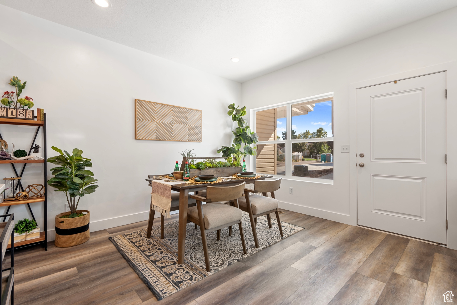 Dining room with hardwood / wood-style flooring