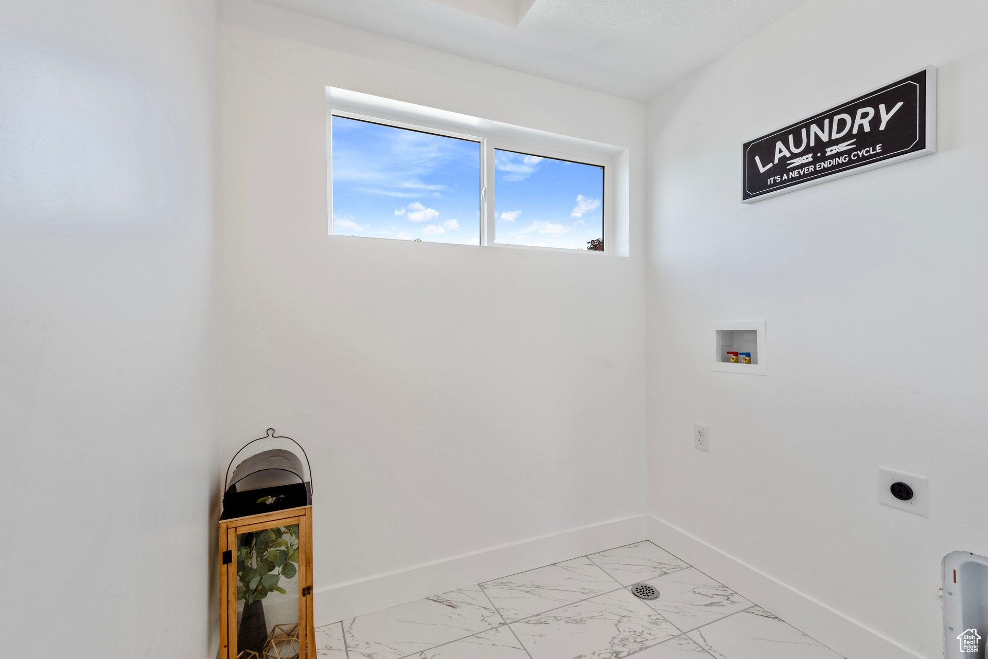 Clothes washing area featuring washer hookup and electric dryer hookup