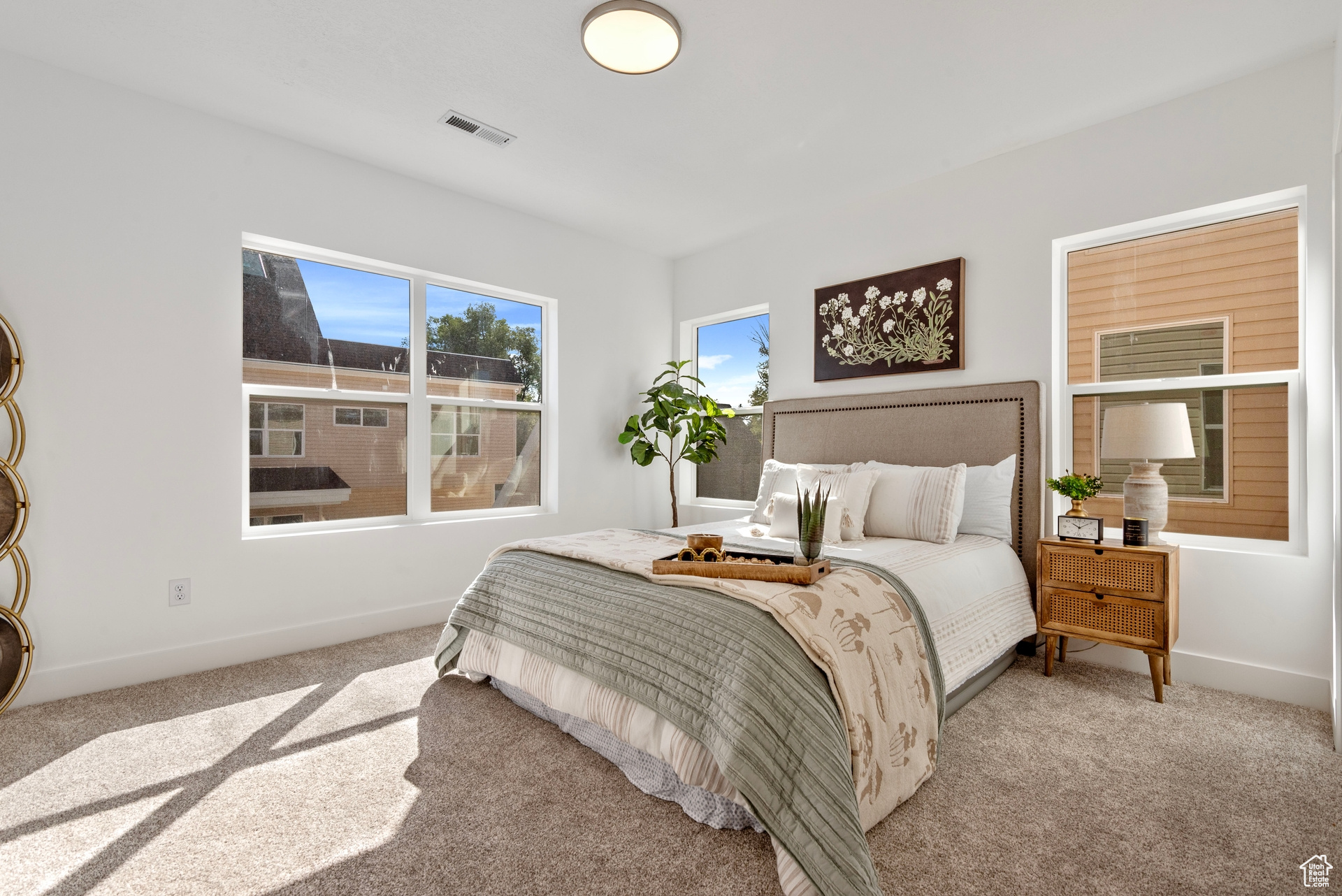 Bedroom with light carpet