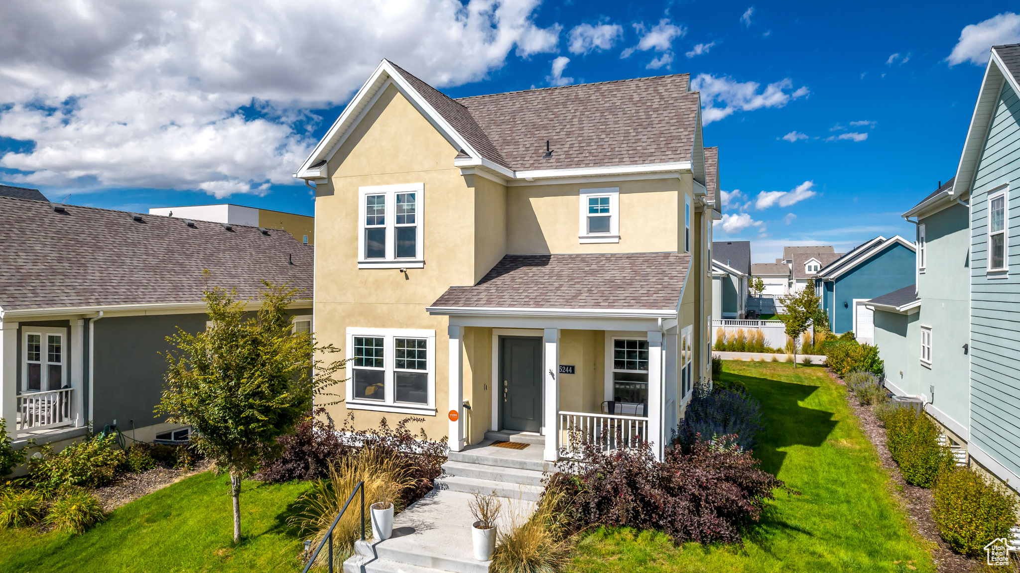 View of front of home featuring a front lawn and covered porch