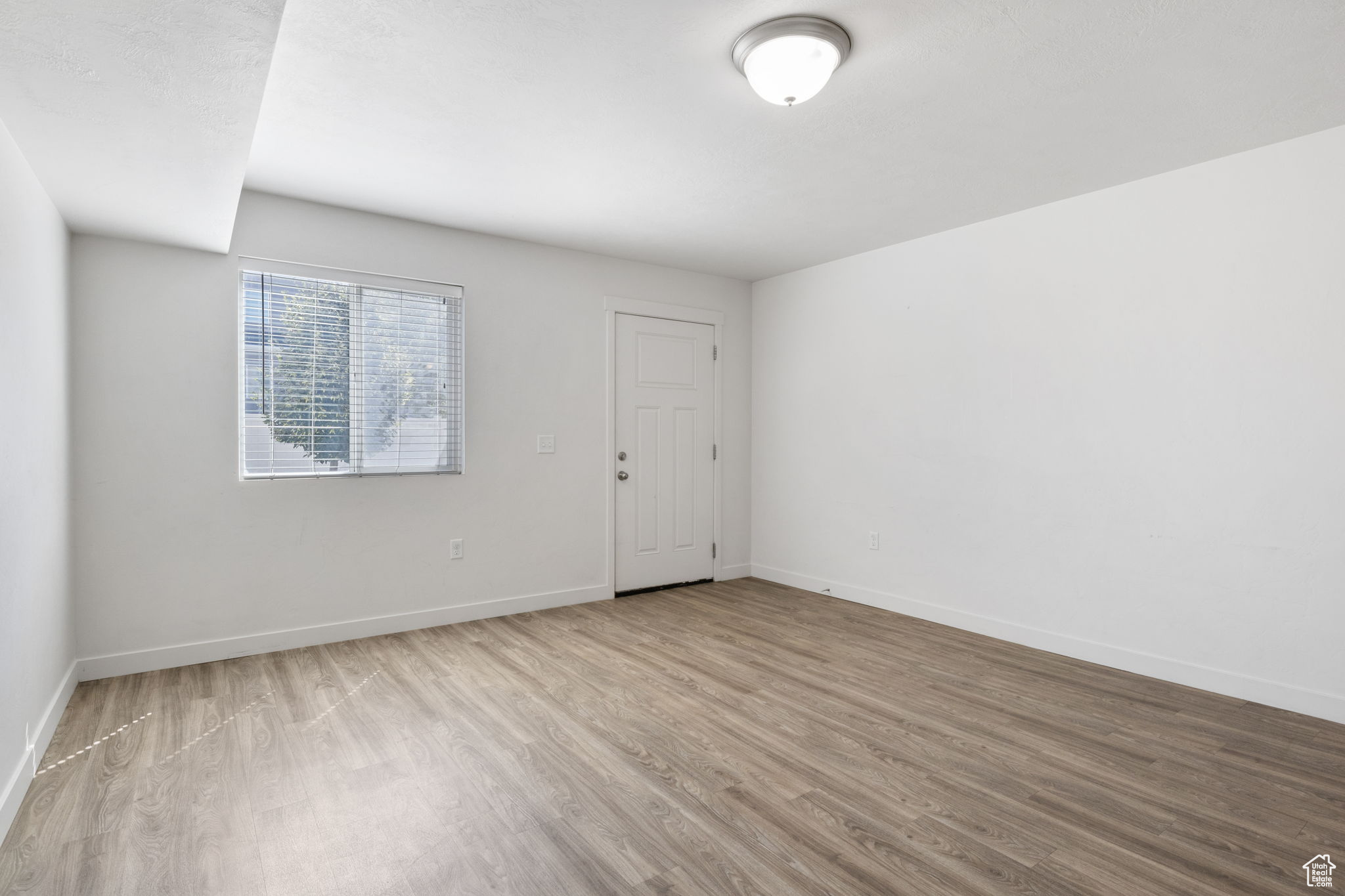 Empty room featuring light hardwood / wood-style flooring