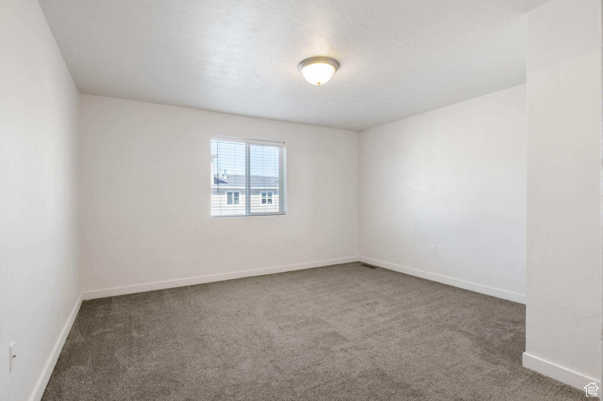 Empty room with carpet flooring