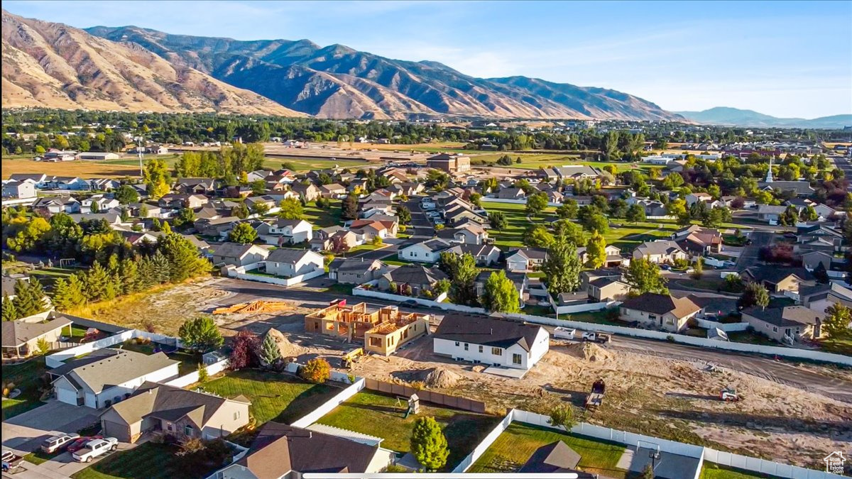 Birds eye view of property with a mountain view