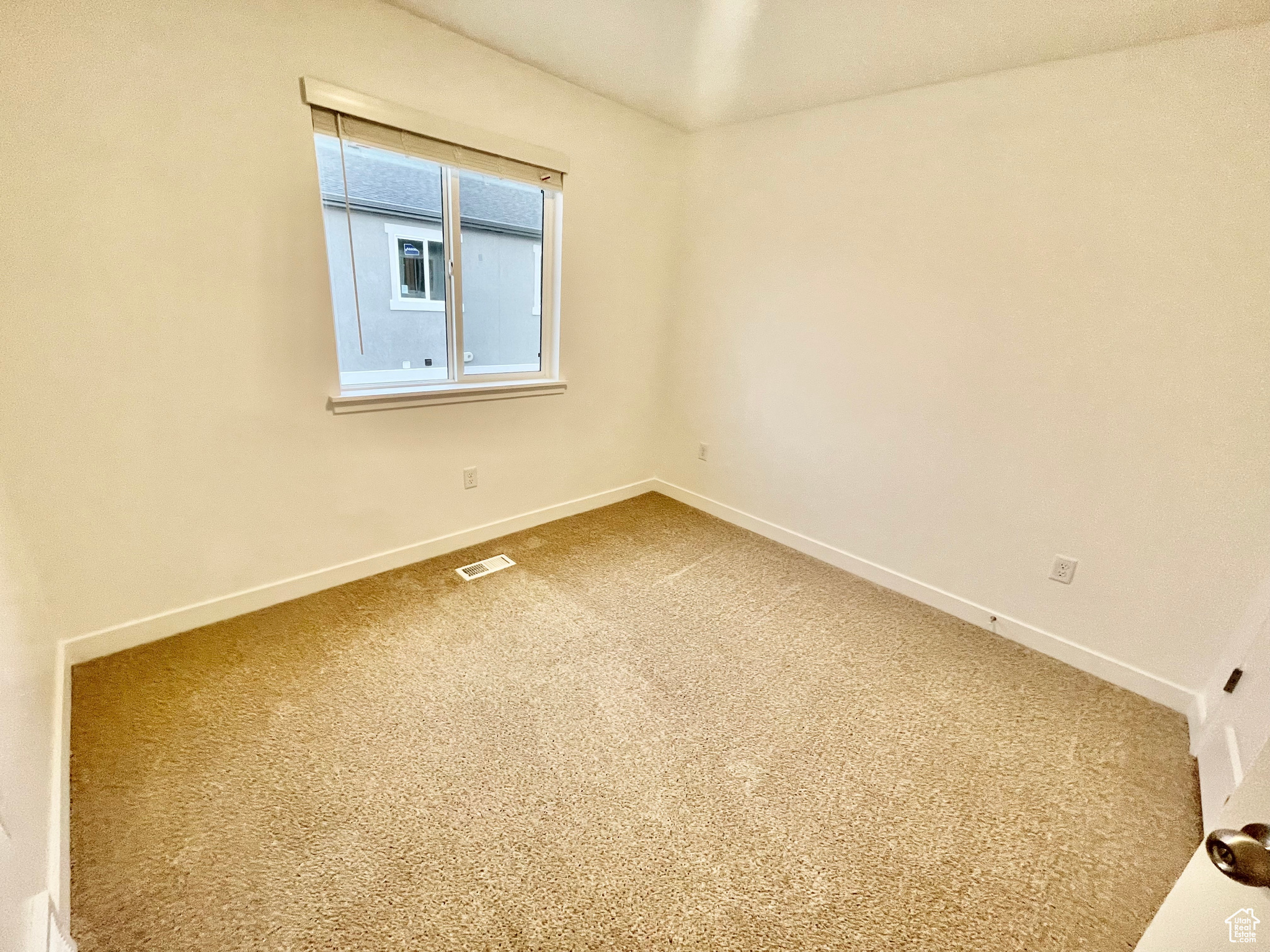 Spare room with carpet floors