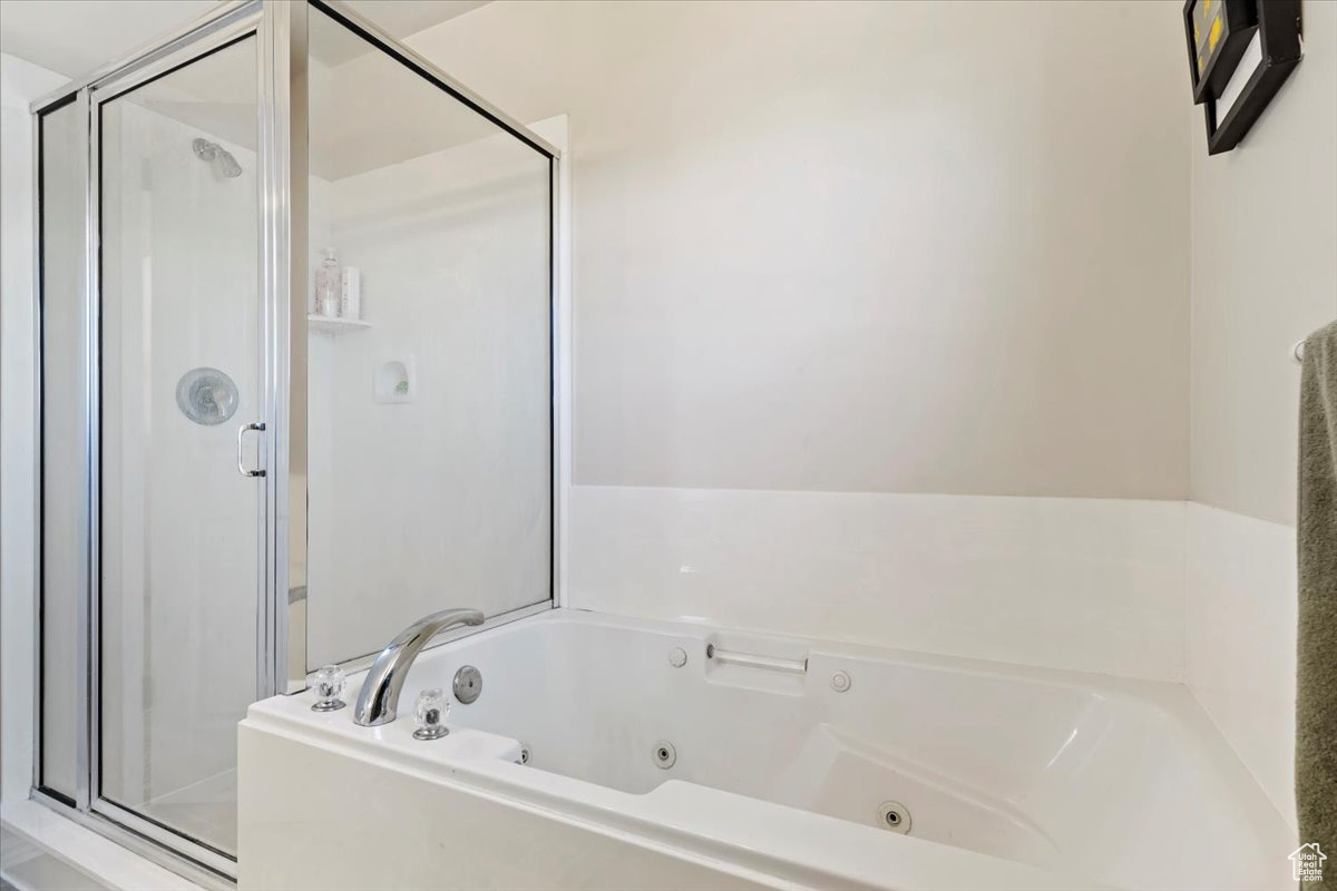 Bathroom with shower with separate bathtub