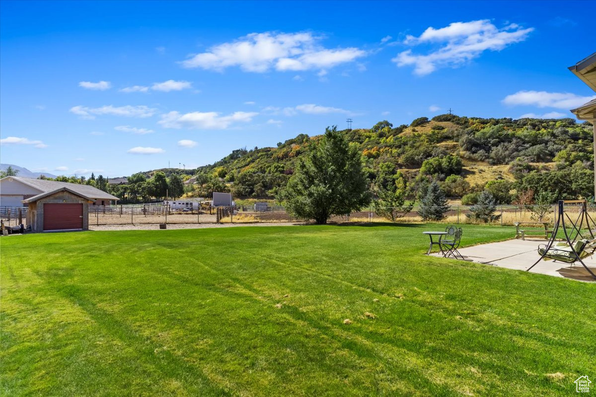 View of yard featuring a patio area and a garage