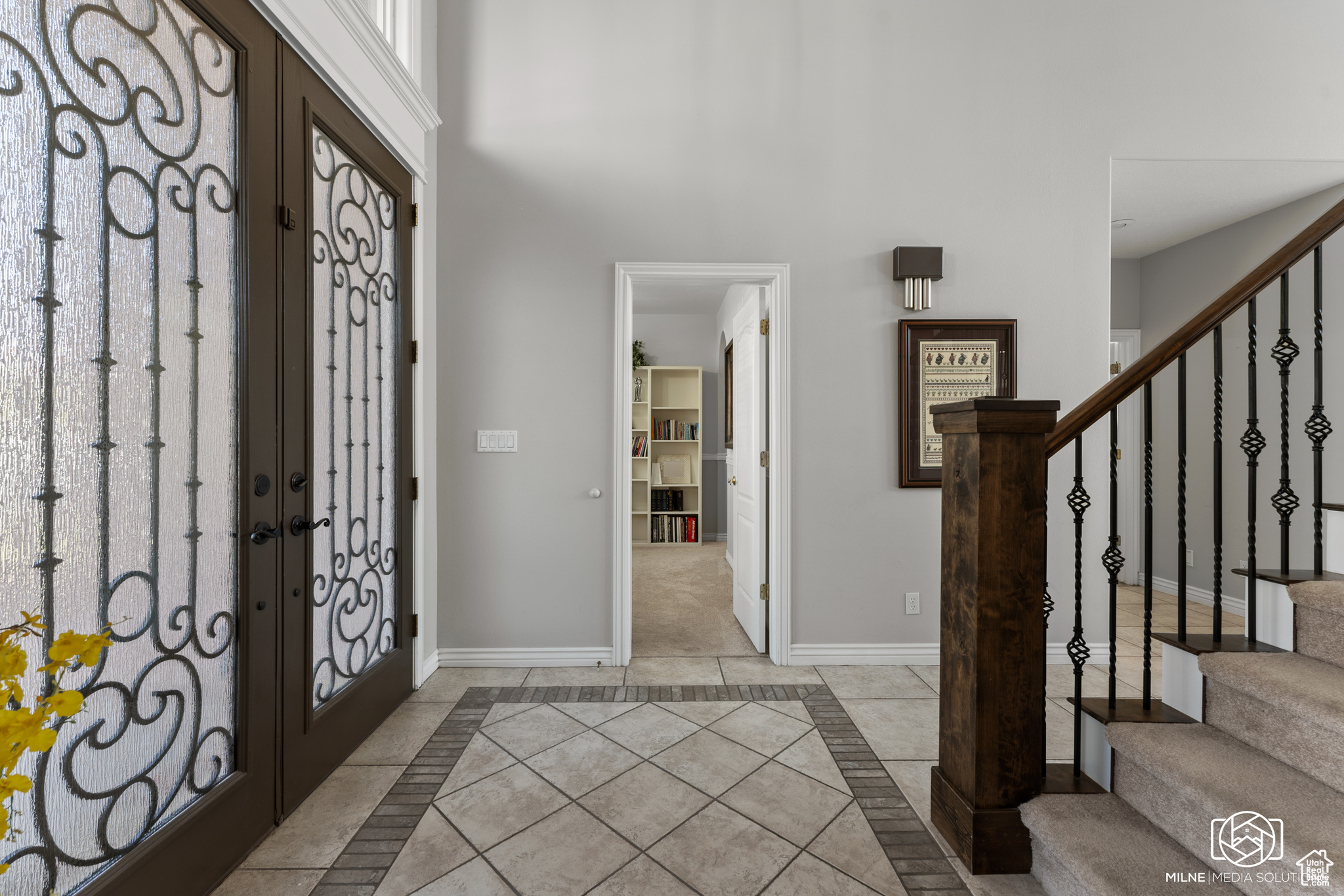 Foyer with light tile patterned floors