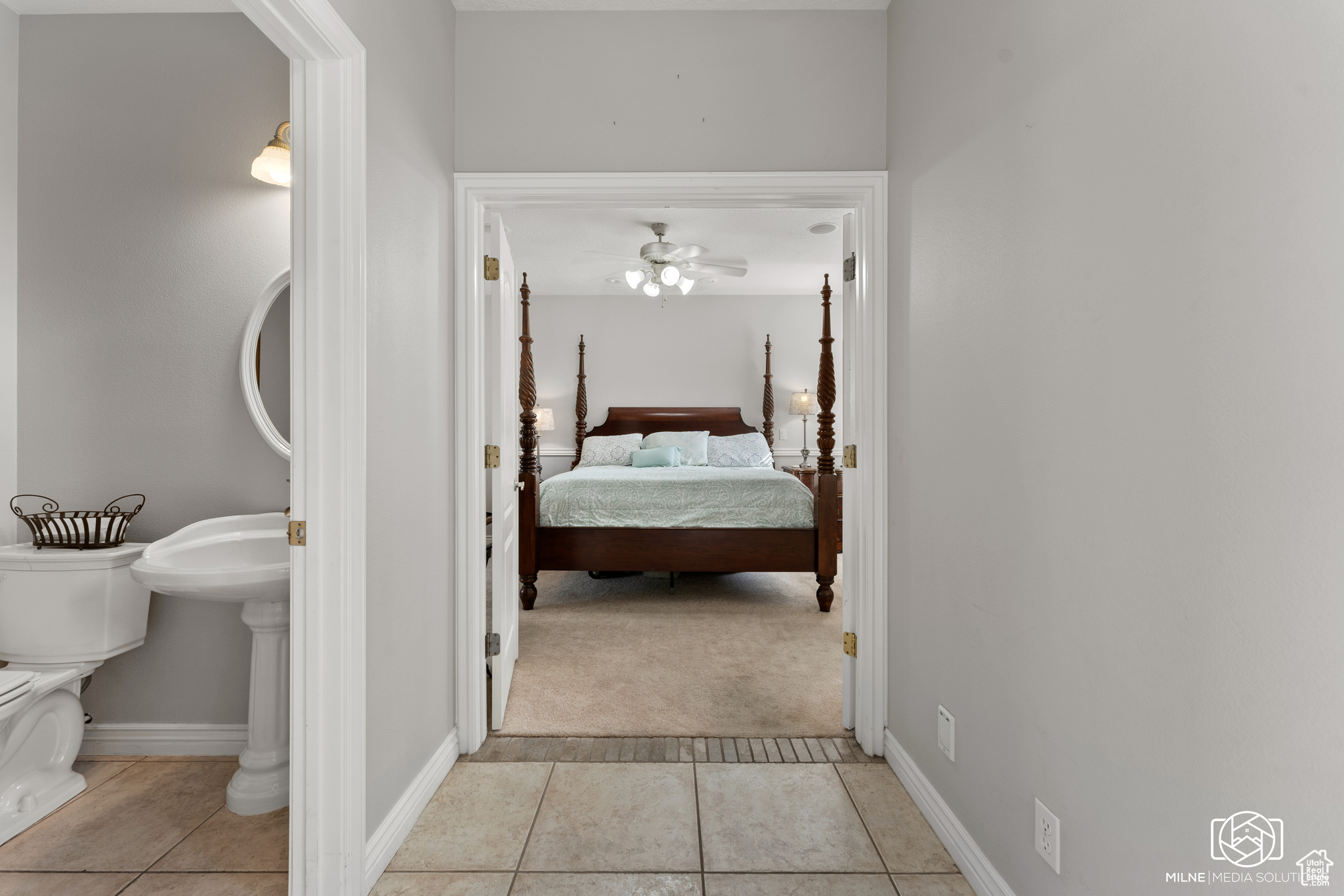 Bathroom featuring ceiling fan and tile patterned floors