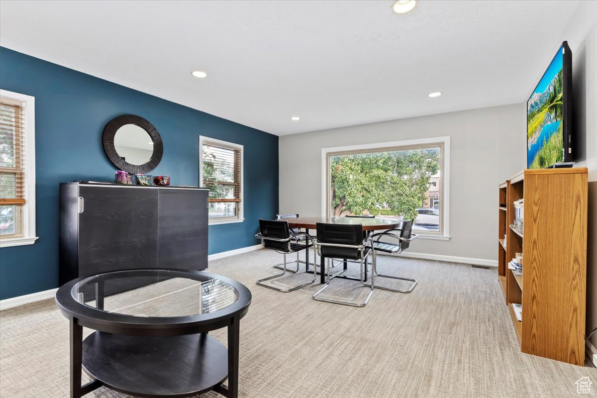 Dining area with light colored carpet