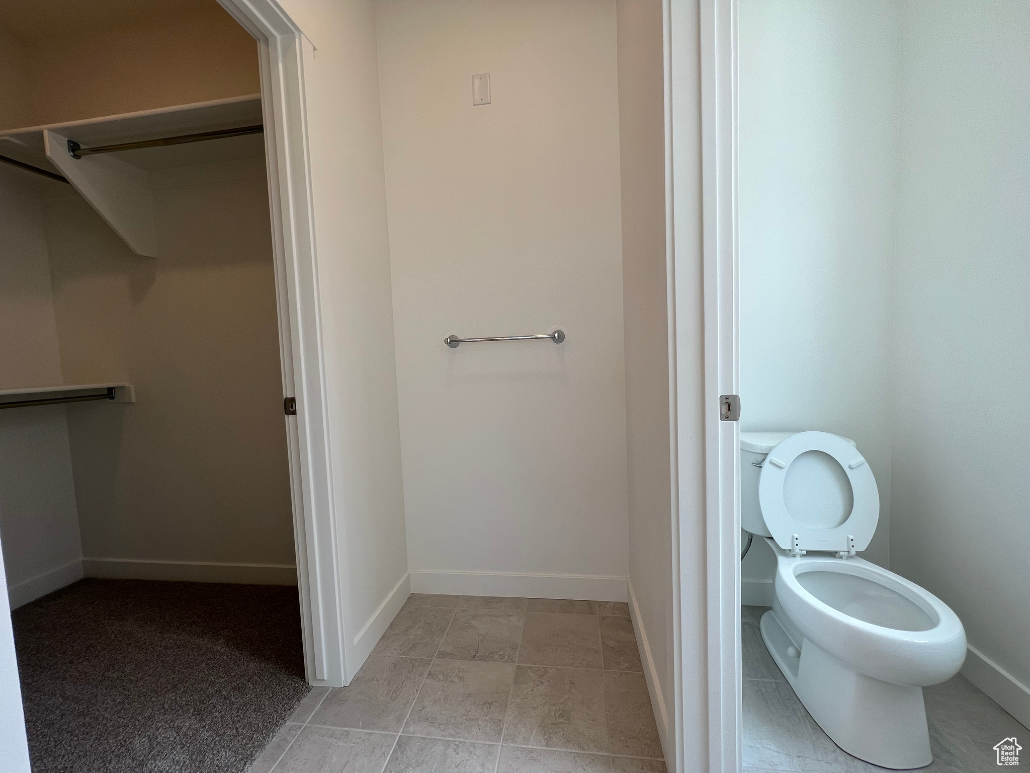 Bathroom with tile patterned floors and toilet