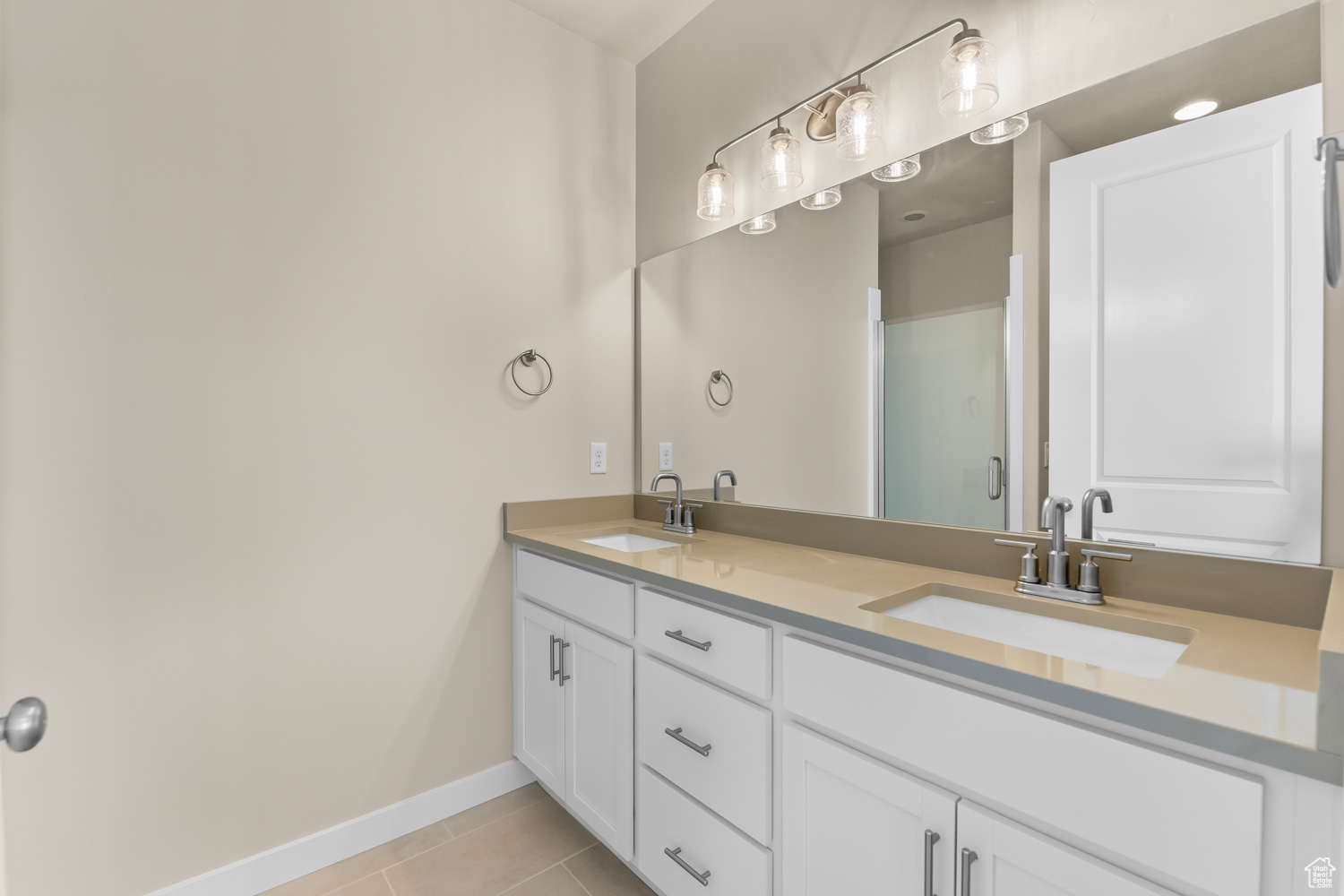 Bathroom featuring vanity and tile patterned floors