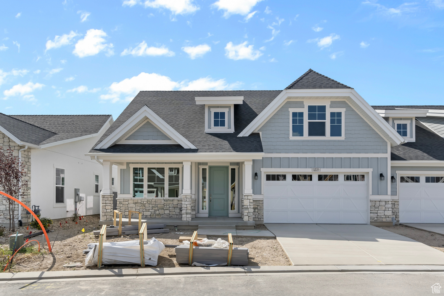 Craftsman inspired home with a porch and a garage