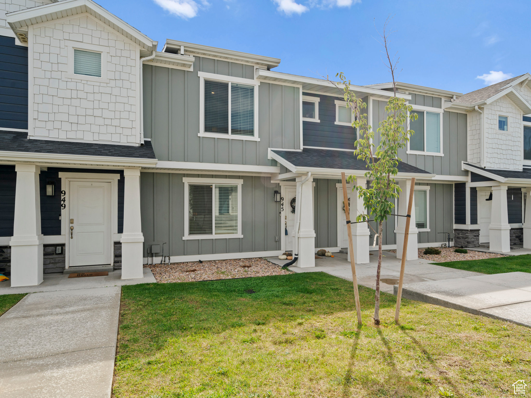 View of property with a front yard