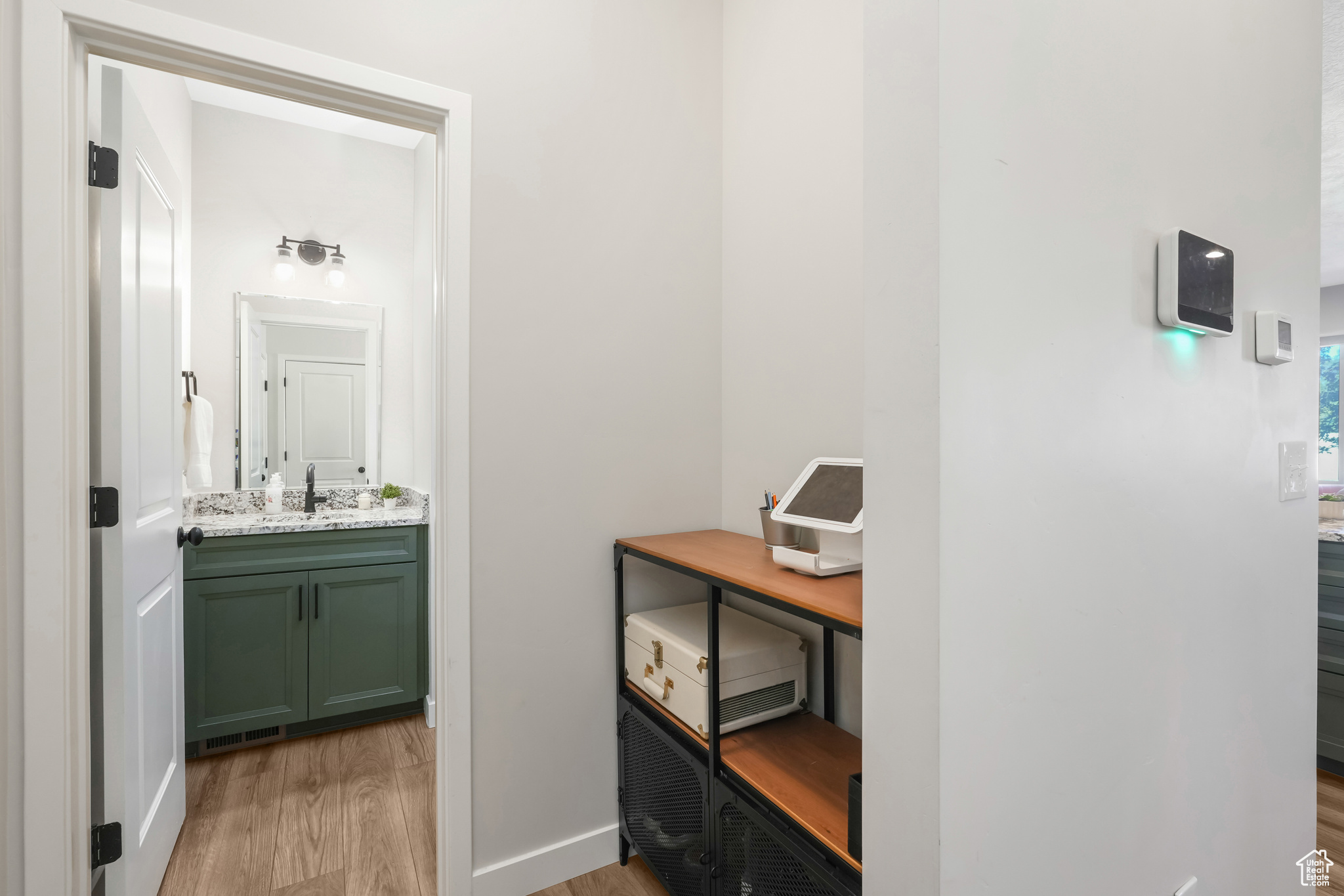 Bathroom with vanity and hardwood / wood-style flooring