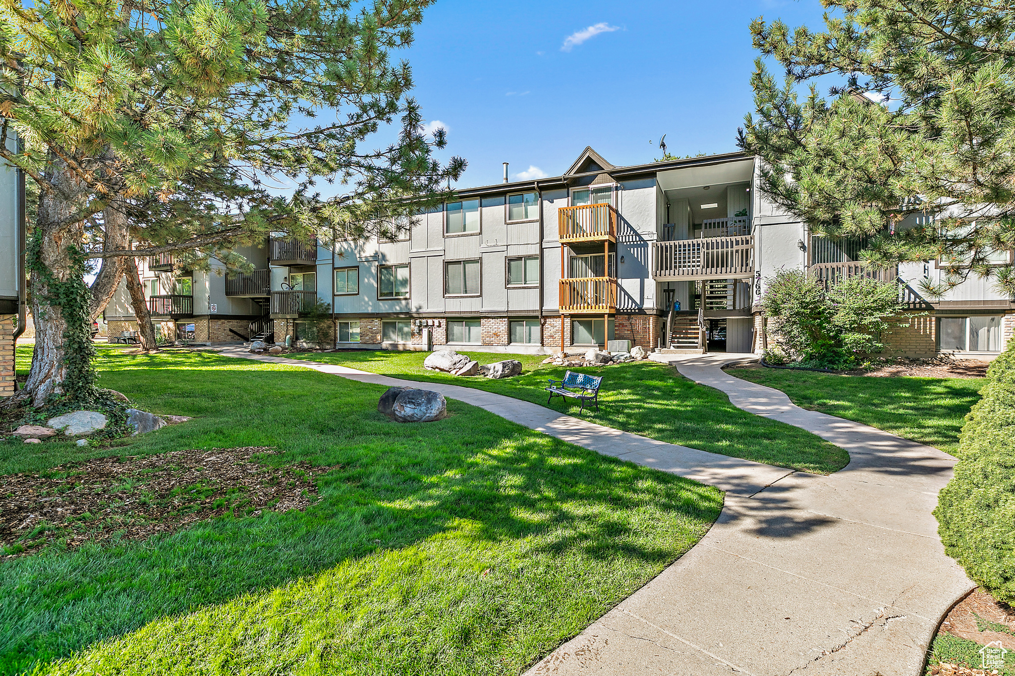 View of community featuring a yard / BACK CORNER UNIT