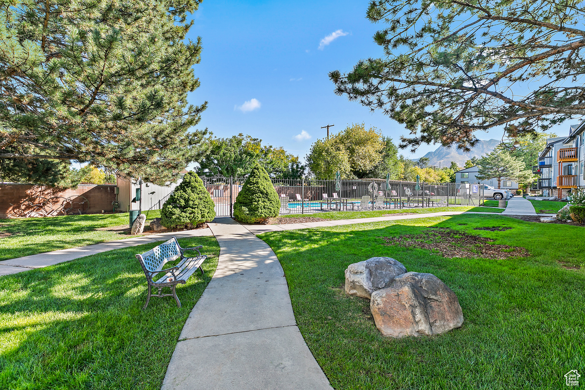 View of community featuring a yard and a pool