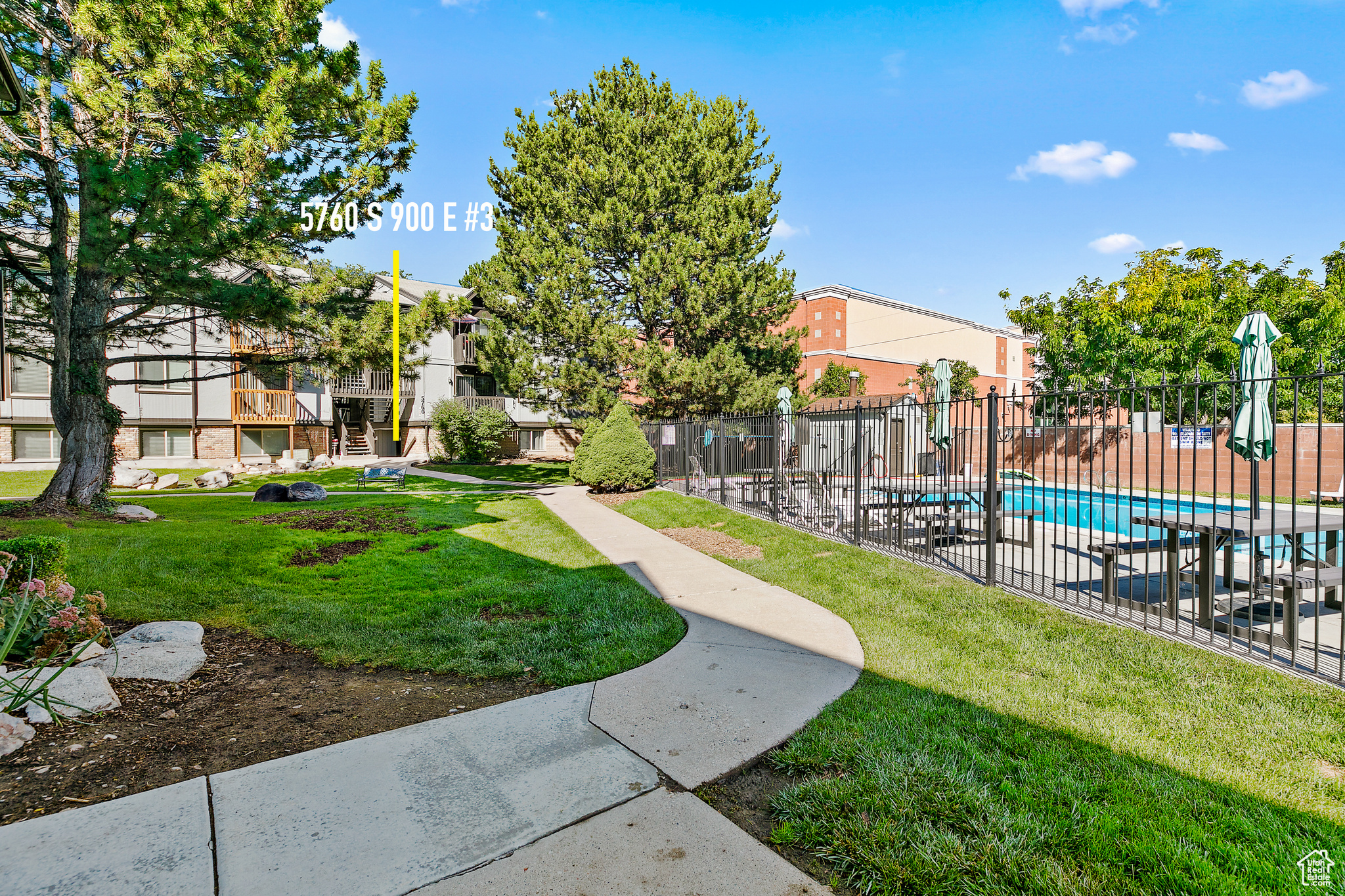 View out front of the unit with pool with a lawn RIGHT OUT FRONT!