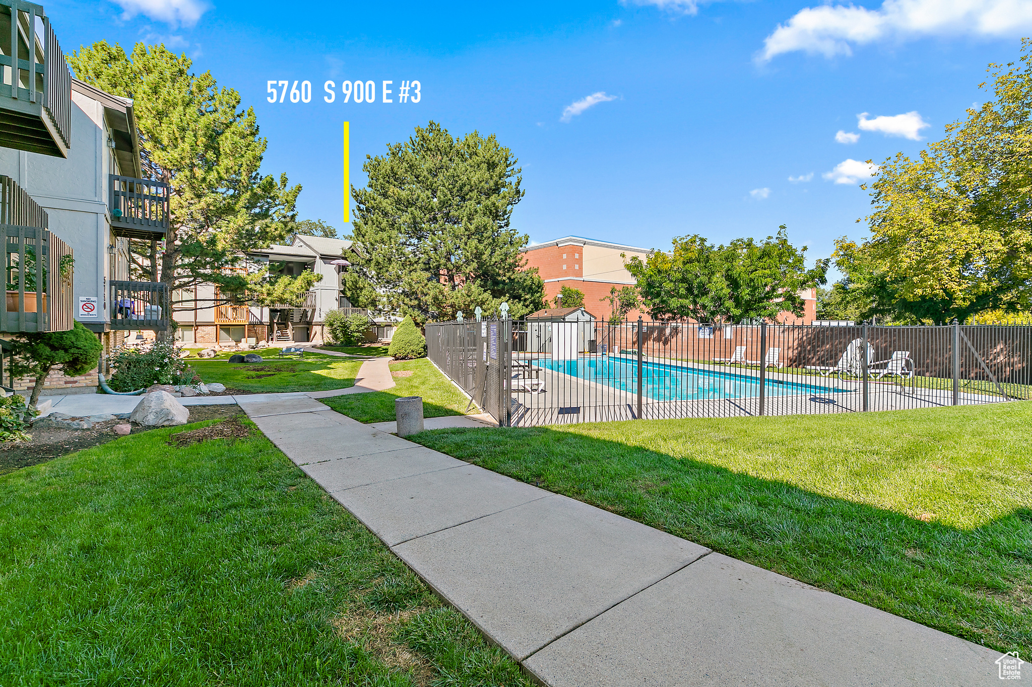 View out front of the unit with pool with a lawn RIGHT OUT FRONT!