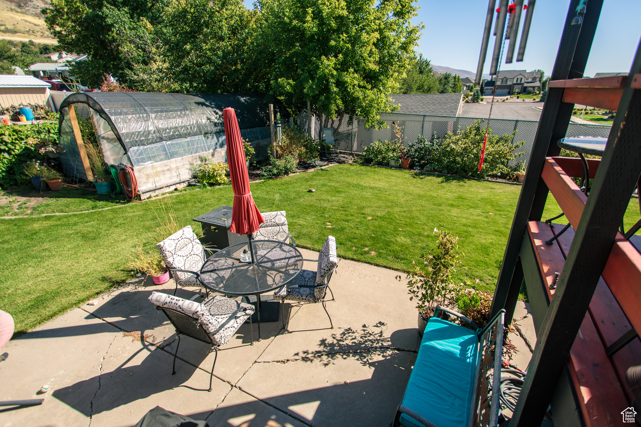 View of patio with a storage shed