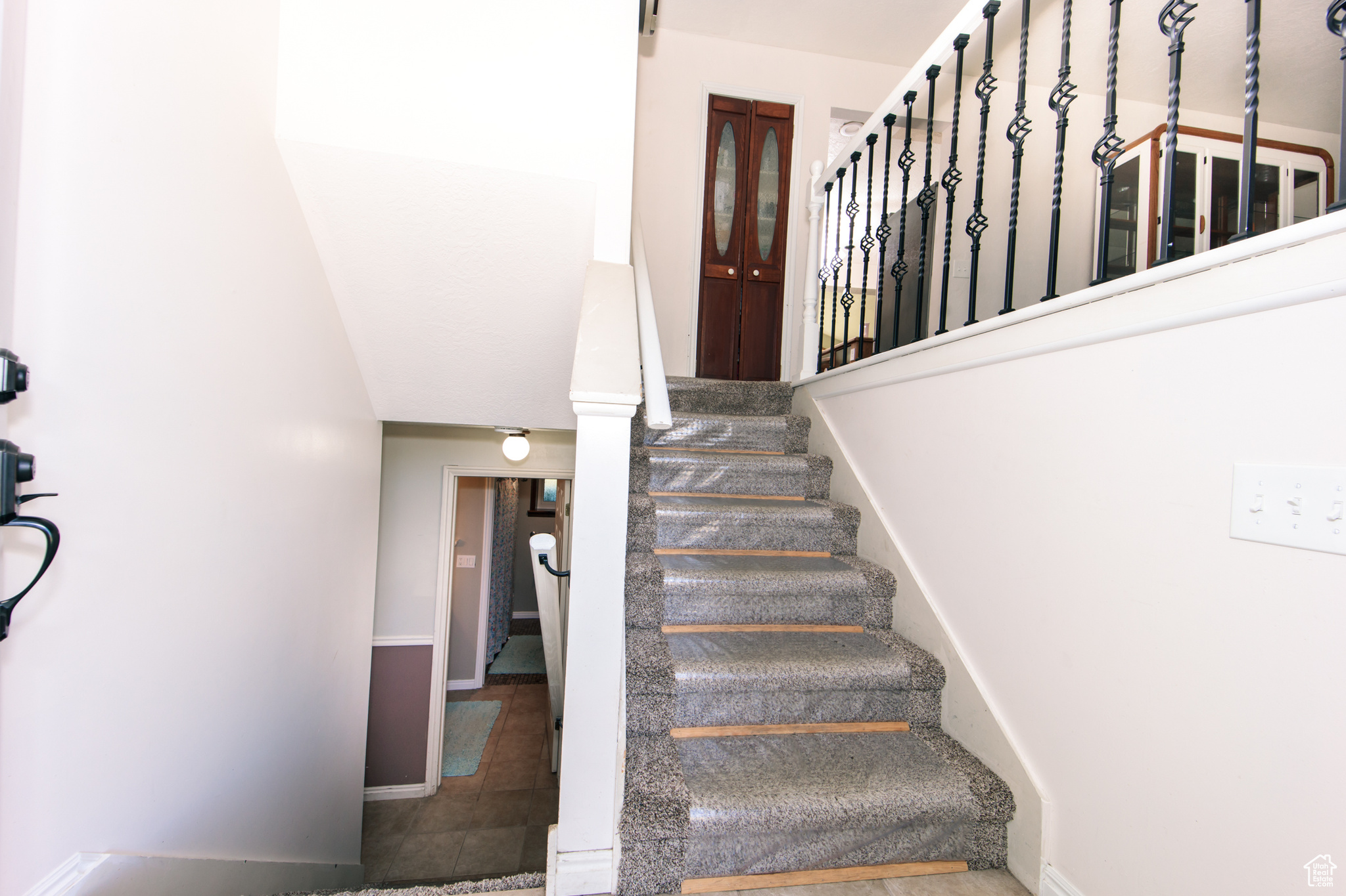 Staircase with hardwood / wood-style flooring