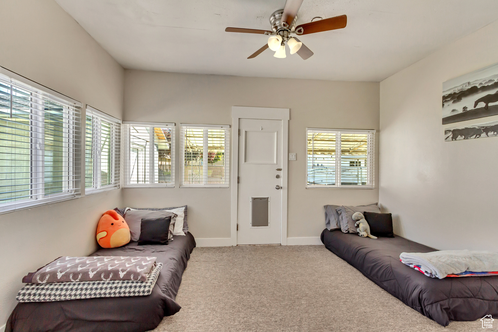 Living room featuring carpet floors and ceiling fan