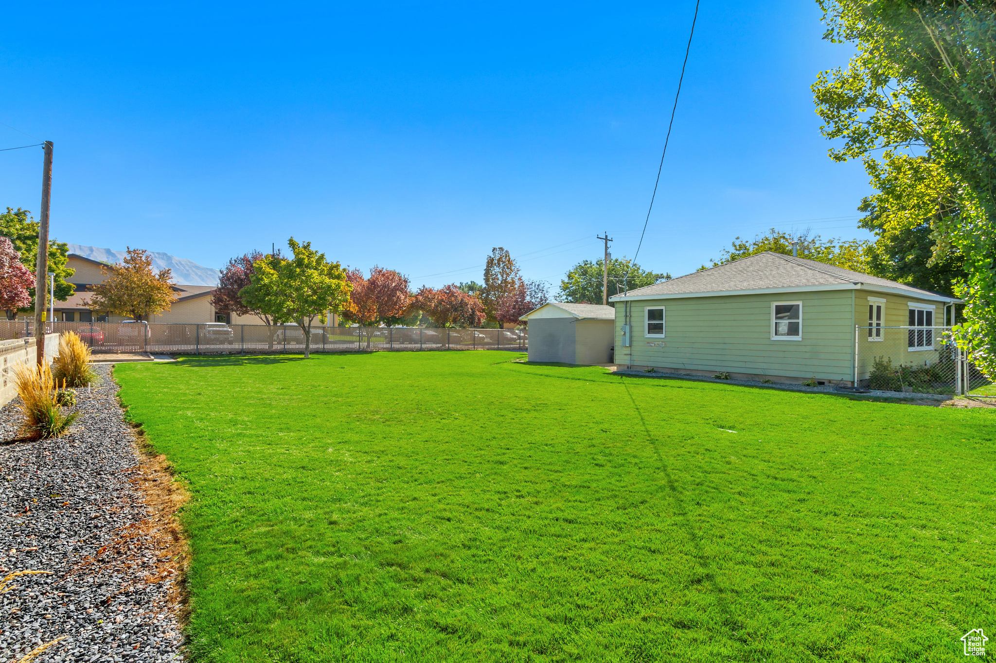 View of yard with a storage unit