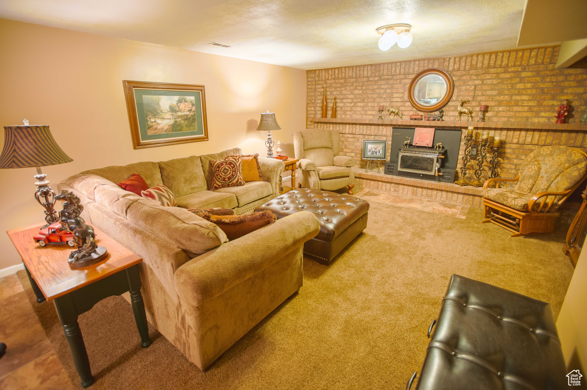 Basement family room with second wood-burning fireplace.