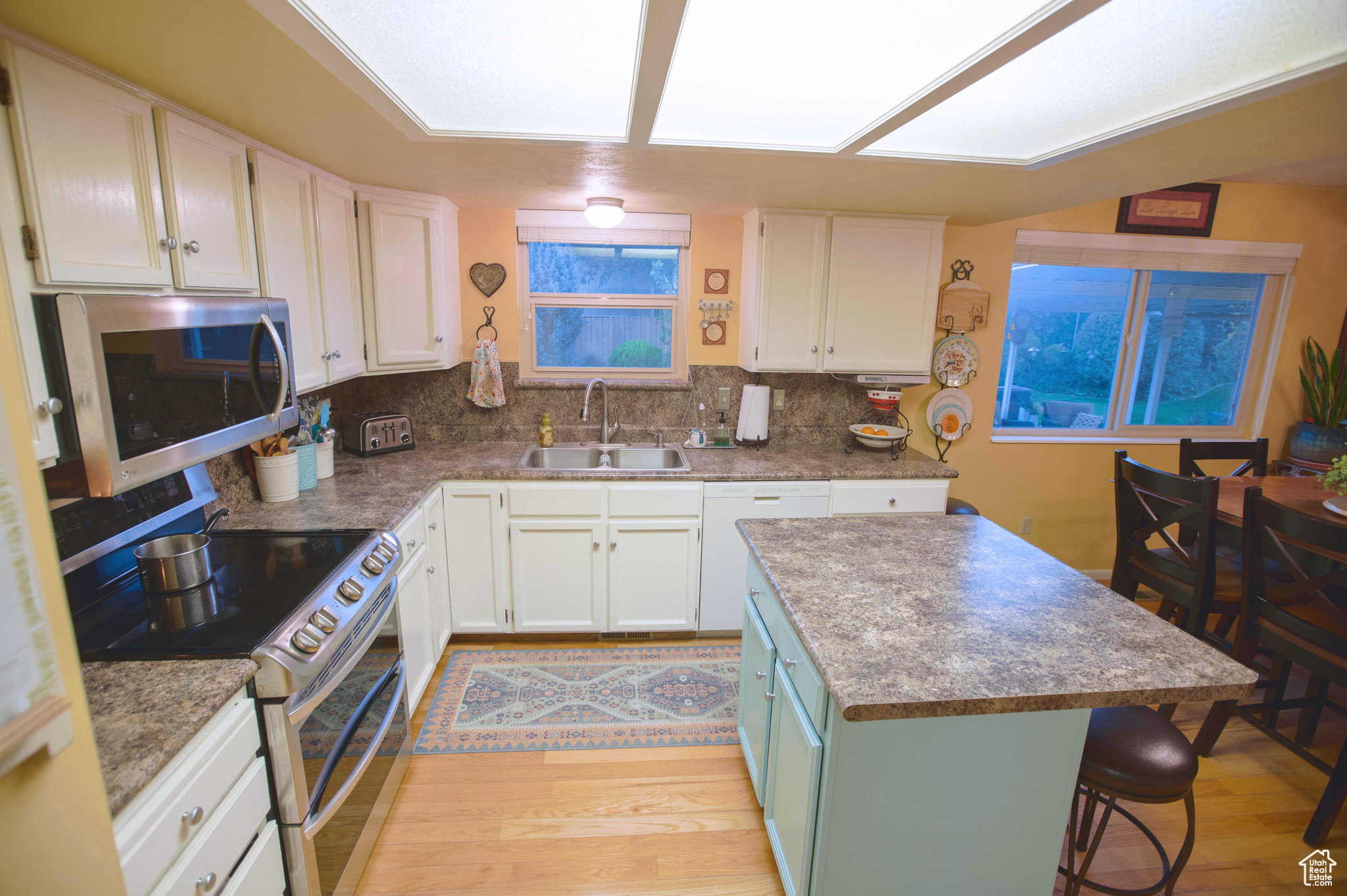 Open kitchen with real oak floors.