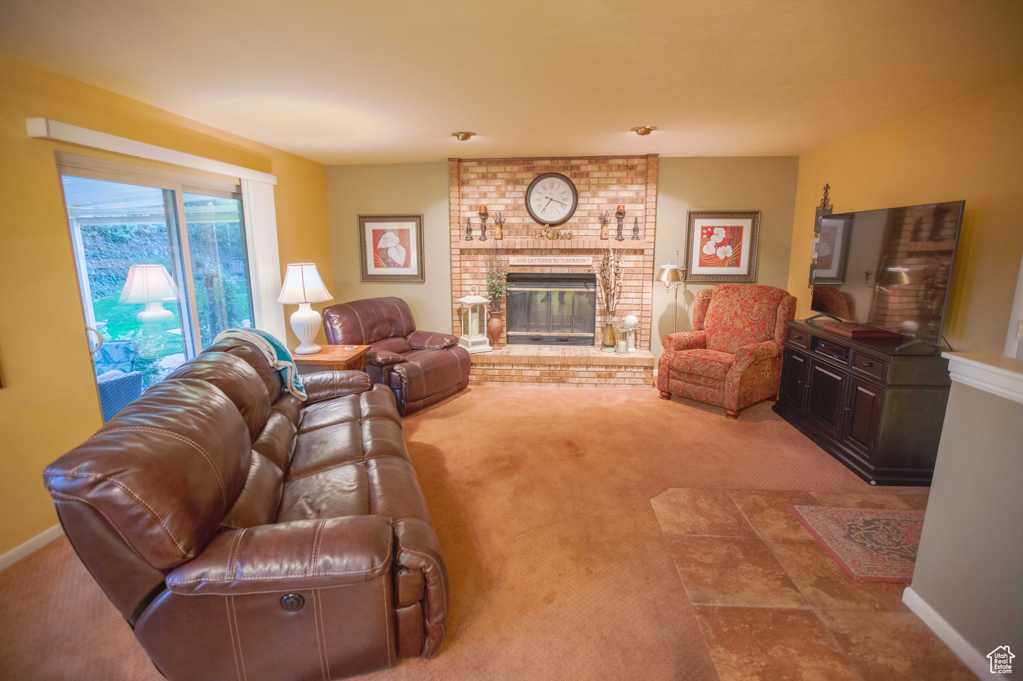 Family room with wood-burning fireplace.