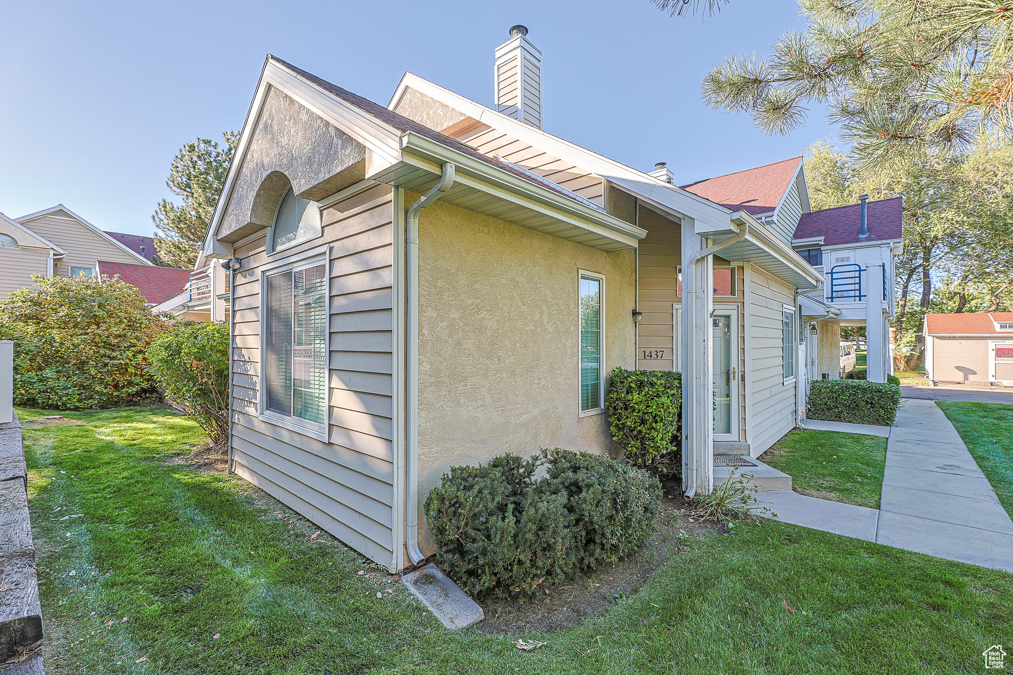 View of property exterior featuring a yard