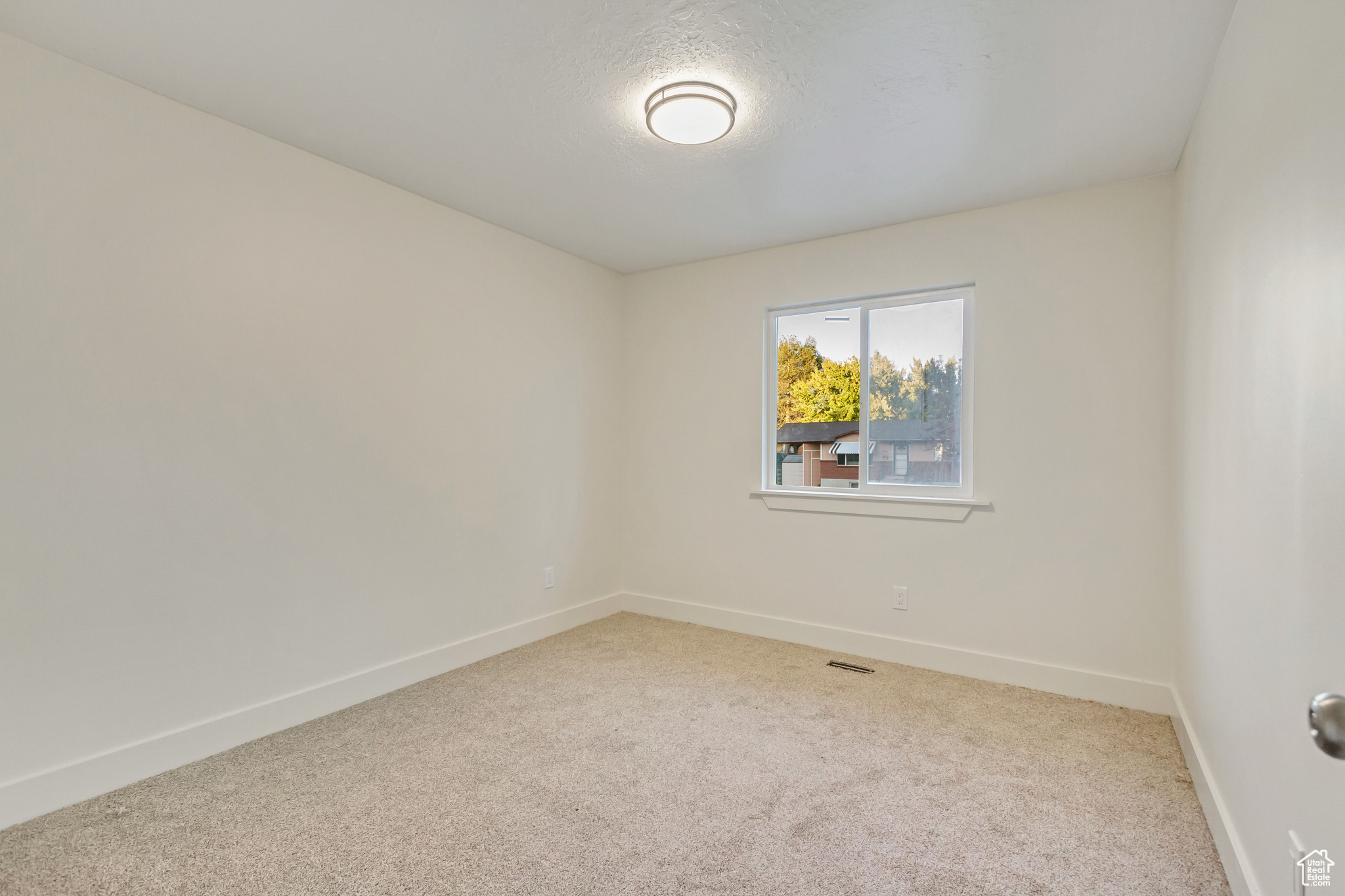 Spare room featuring carpet floors