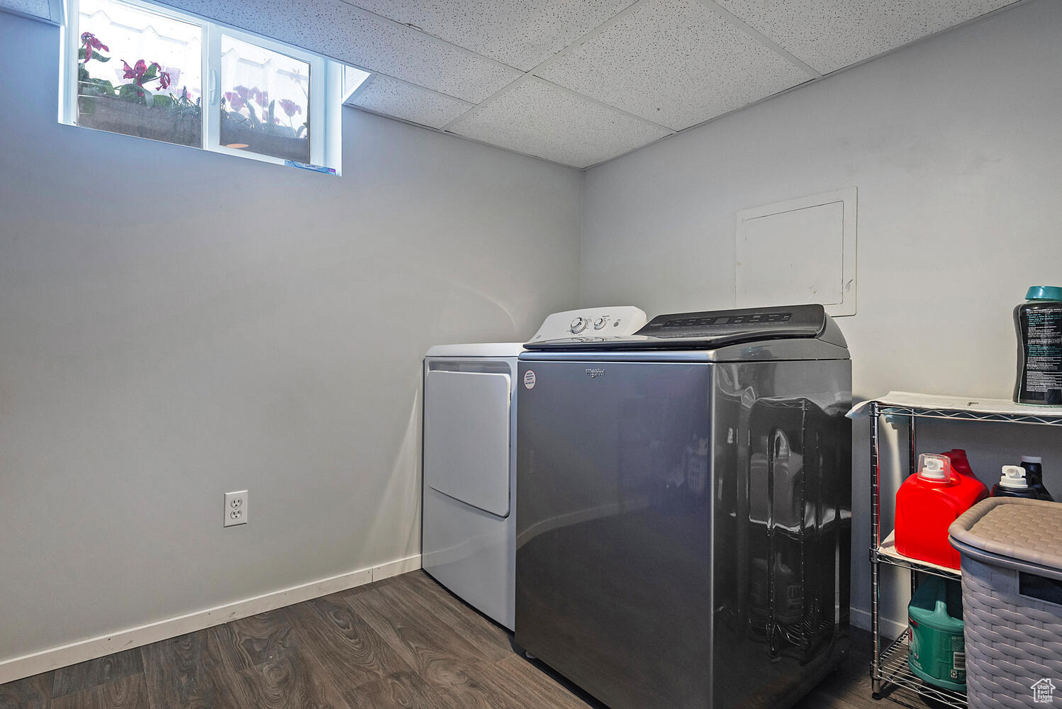 Laundry room featuring dark hardwood / wood-style floors and washer and dryer