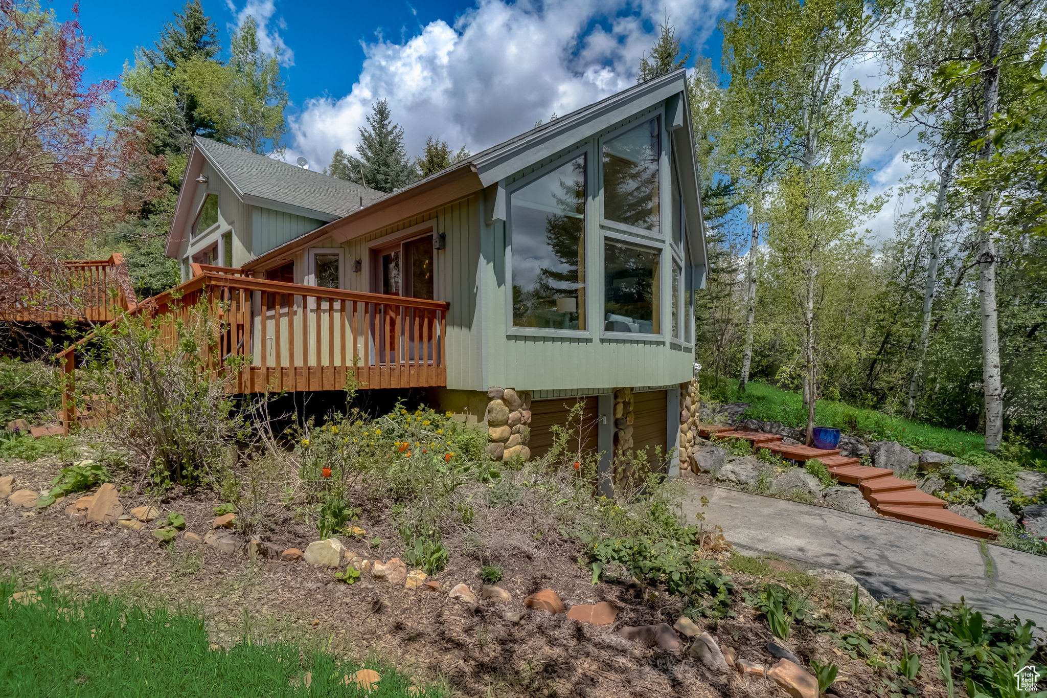 View of property exterior with a deck