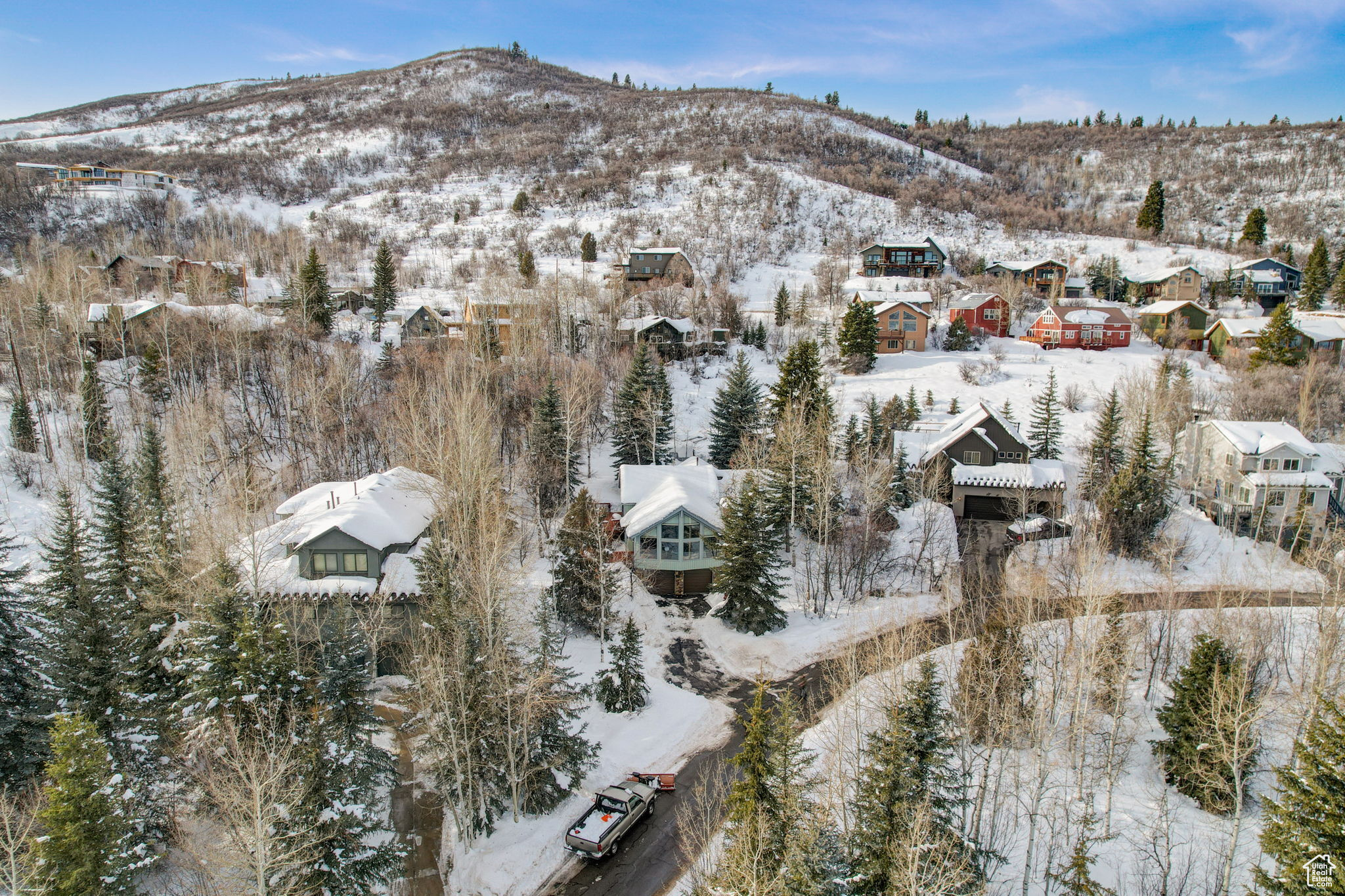 Snowy aerial view with a mountain view