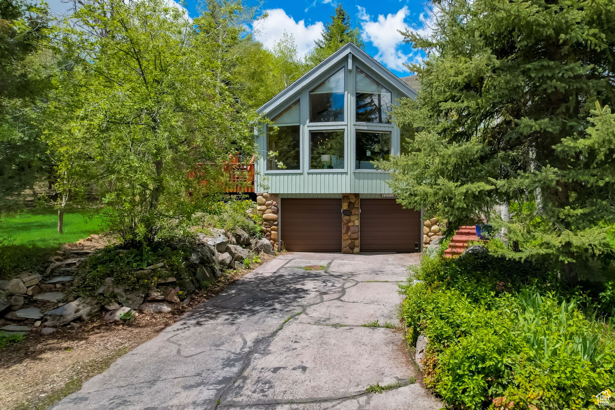 View of property exterior with a garage