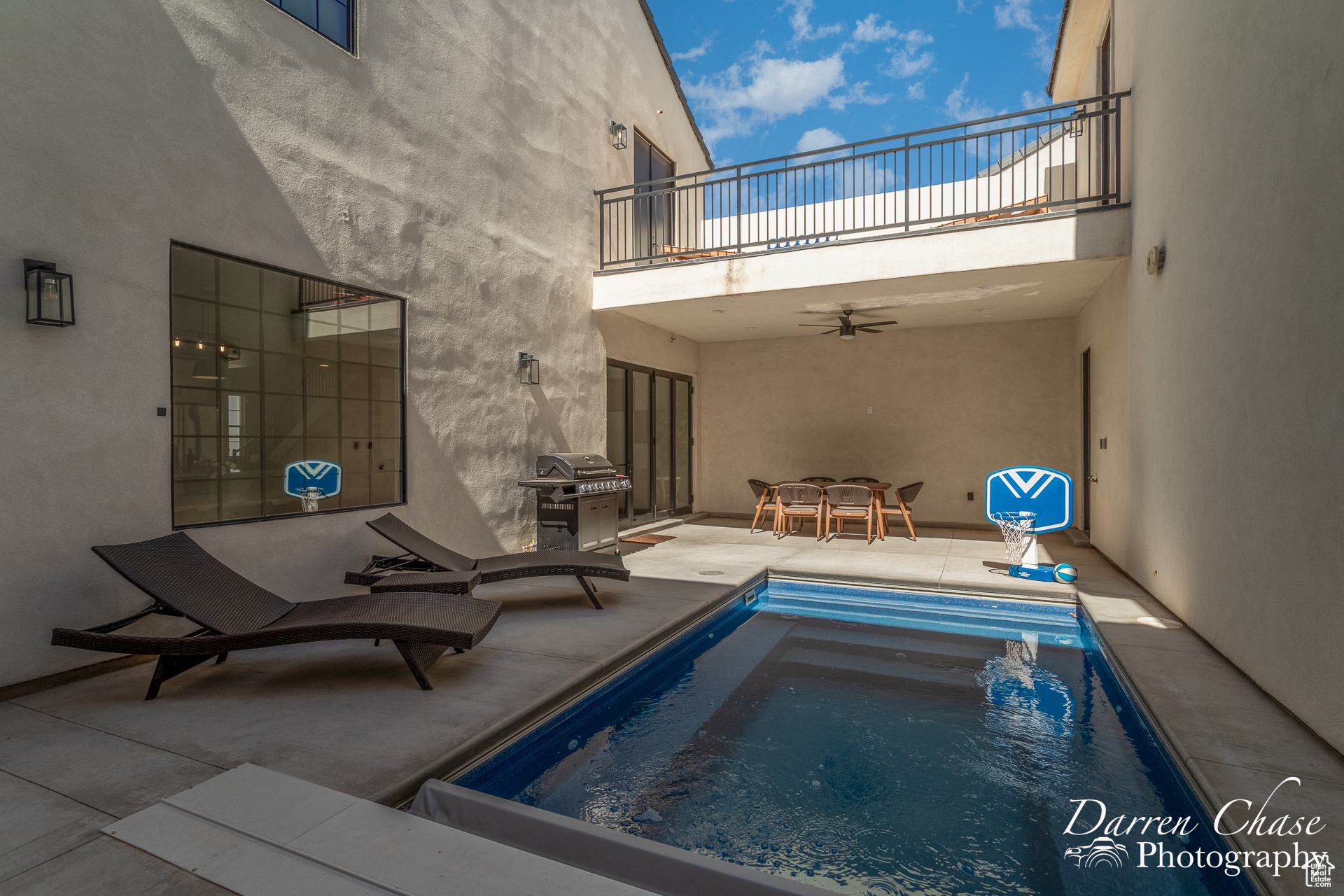 View of pool with a hot tub, ceiling fan, a grill, and a patio area