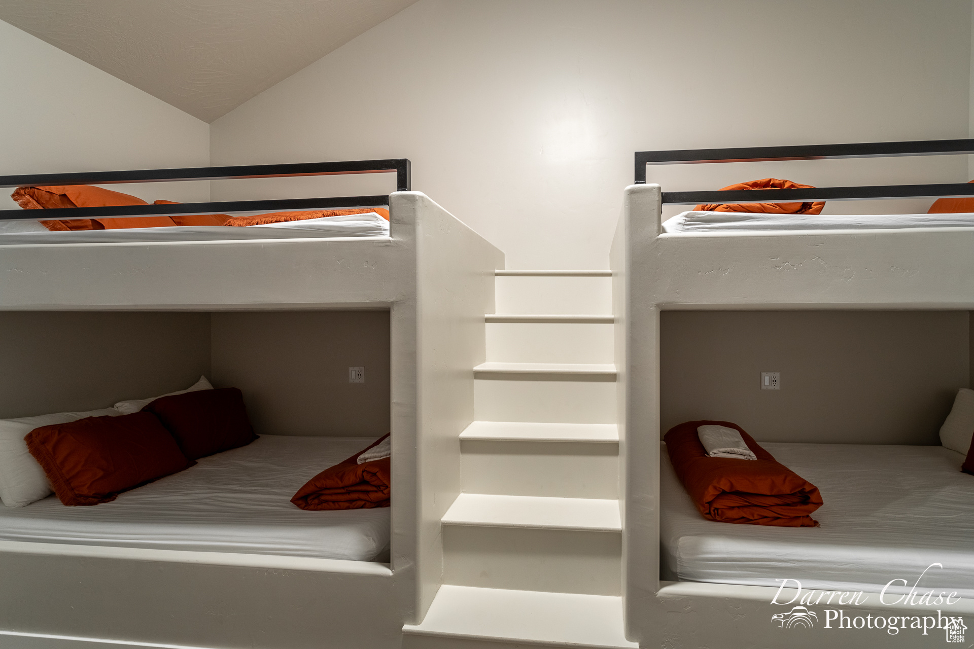 Bedroom featuring vaulted ceiling