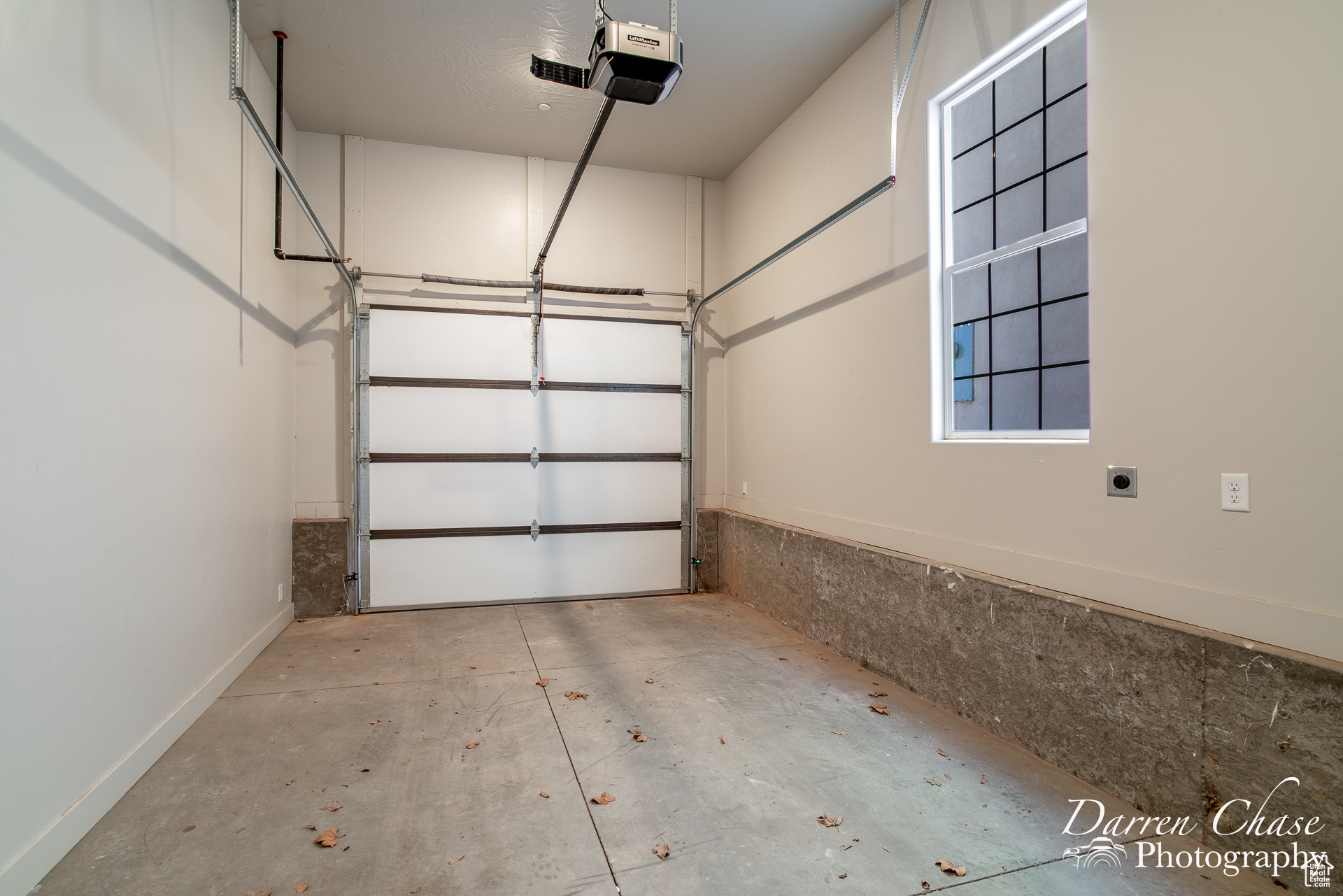 Garage featuring a garage door opener