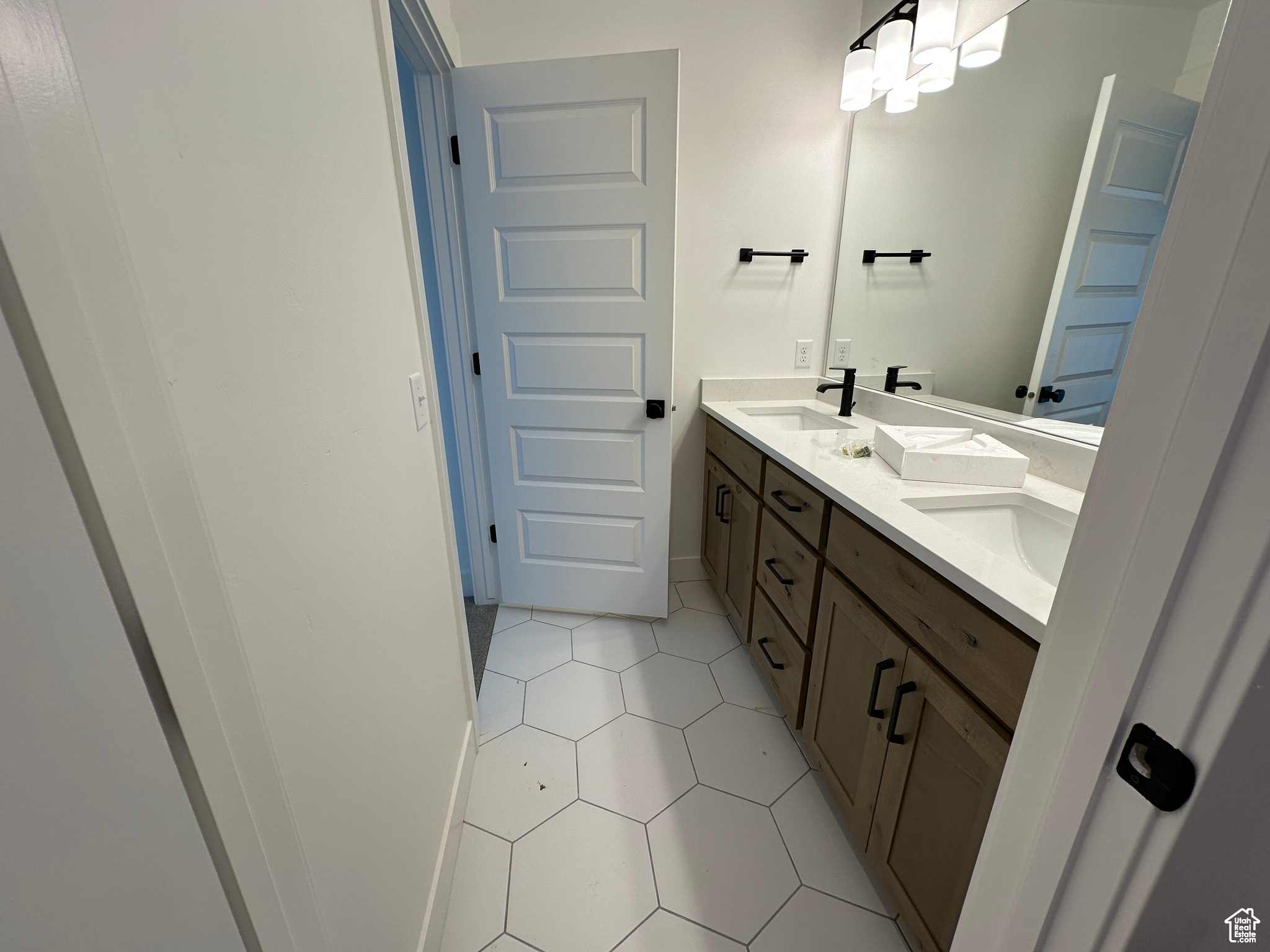 Bathroom with tile patterned flooring and vanity