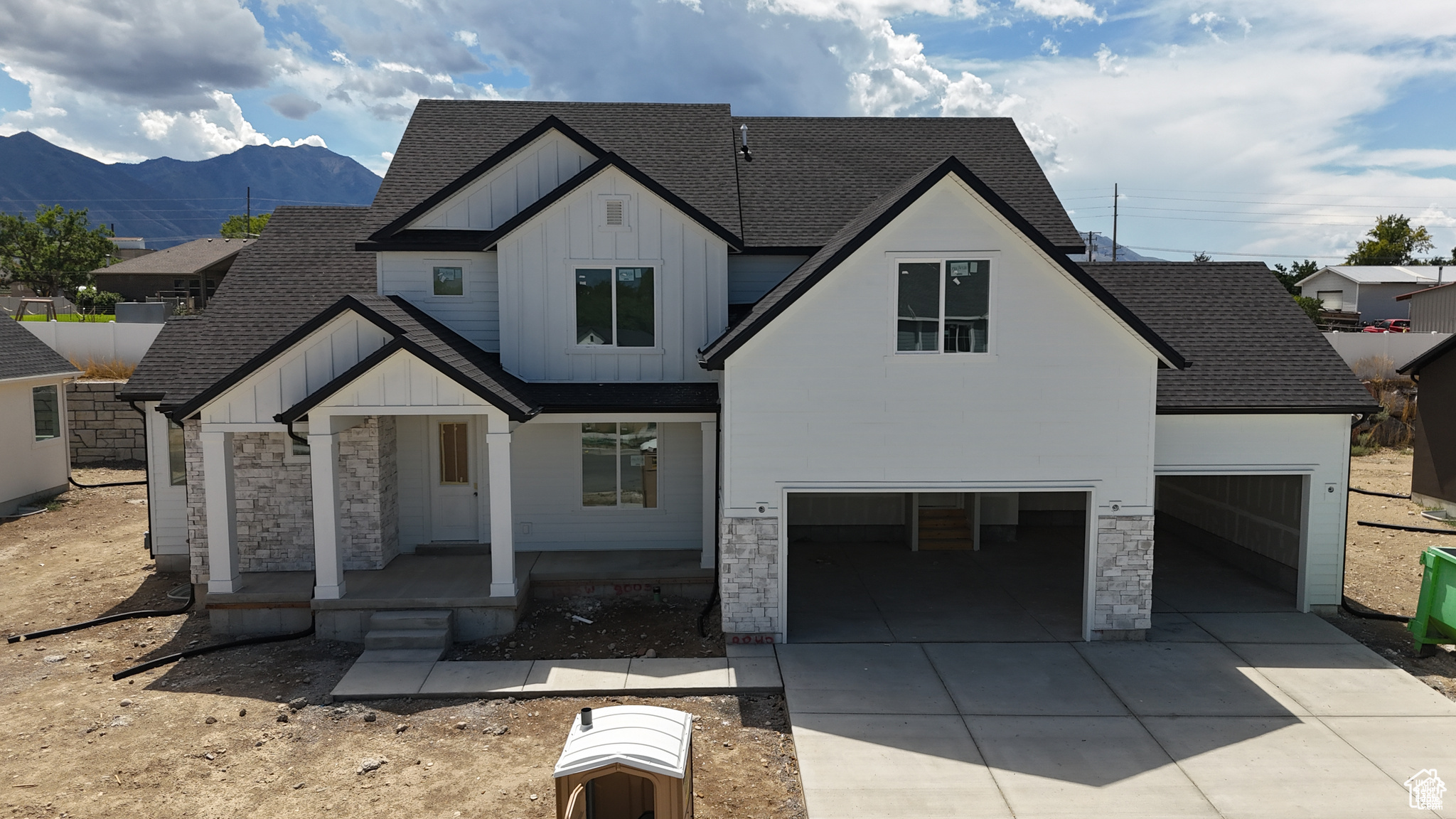 View of front facade featuring a porch and a mountain view