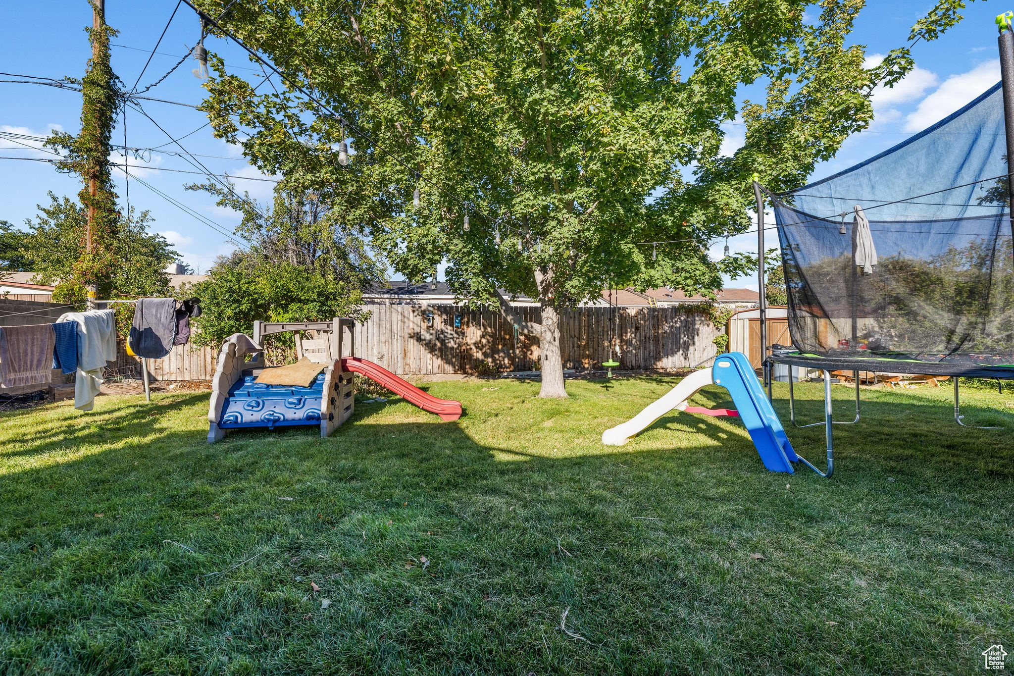 View of yard with a trampoline