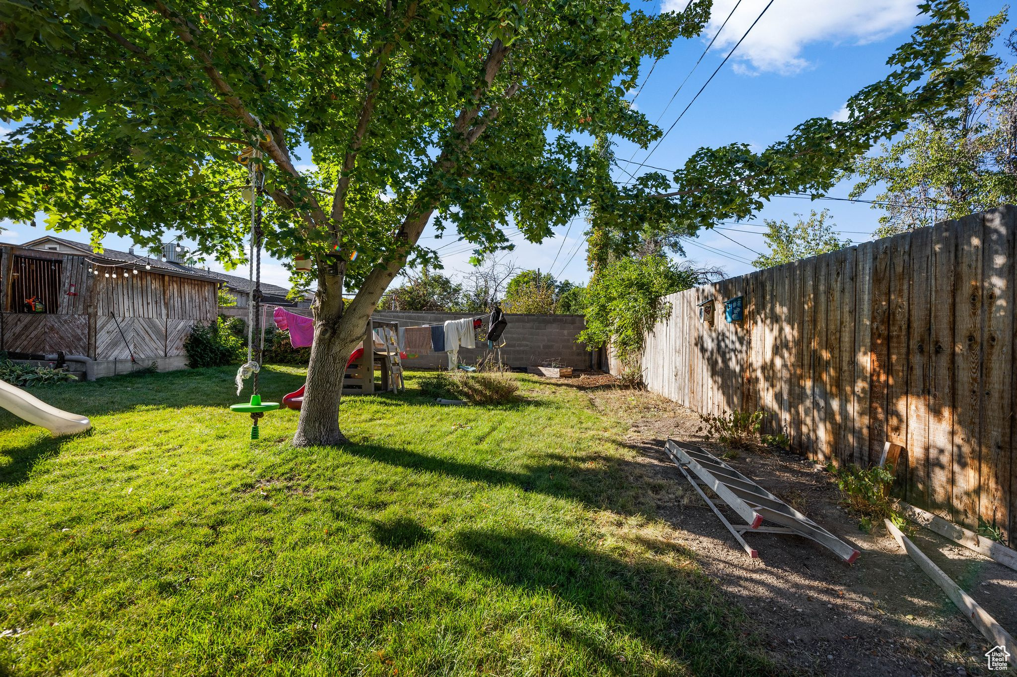 View of yard featuring a storage unit