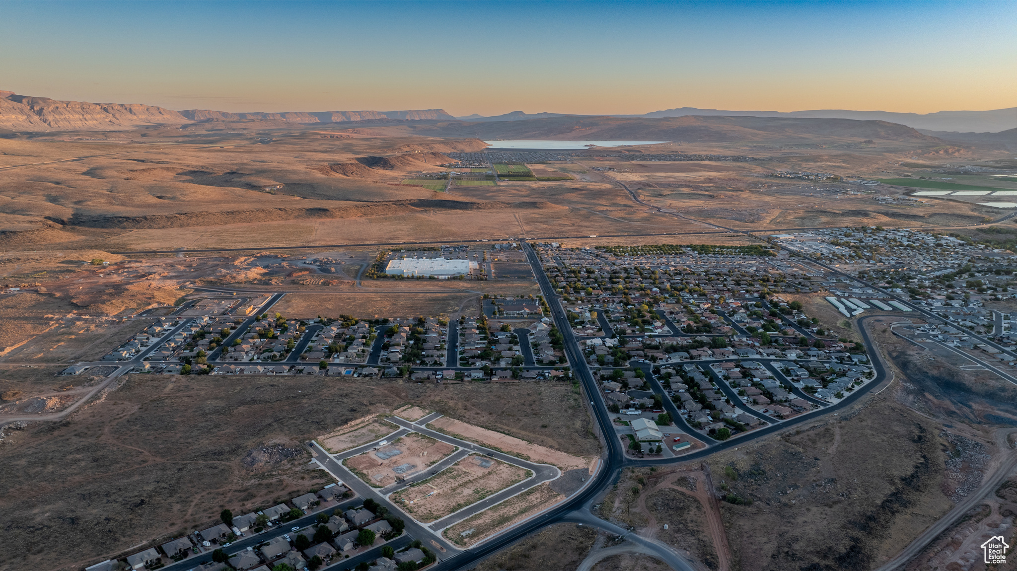 Aerial view at dusk featuring a mountain view