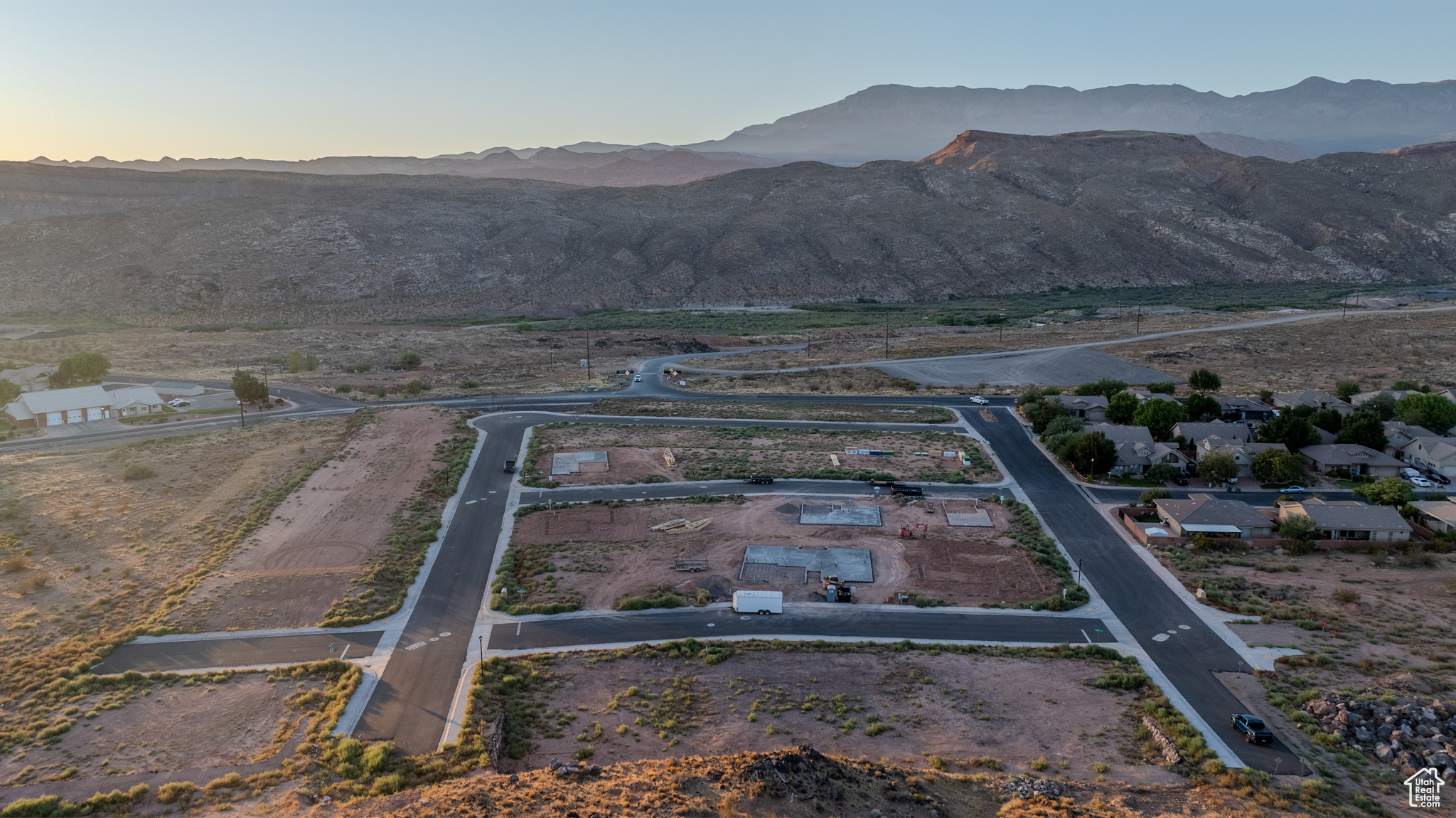 Aerial view at dusk featuring a mountain view