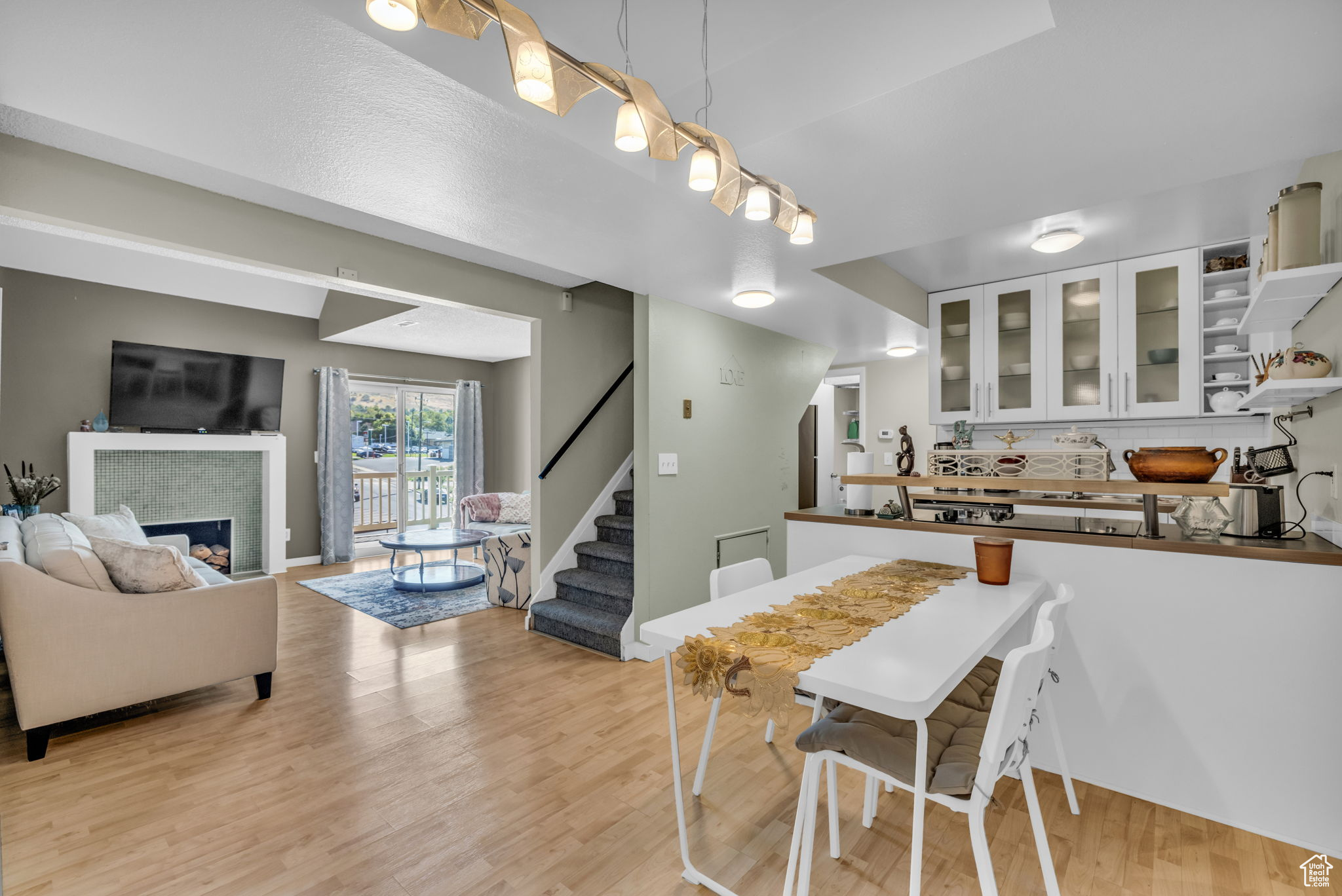 Dining space with light hardwood / wood-style floors