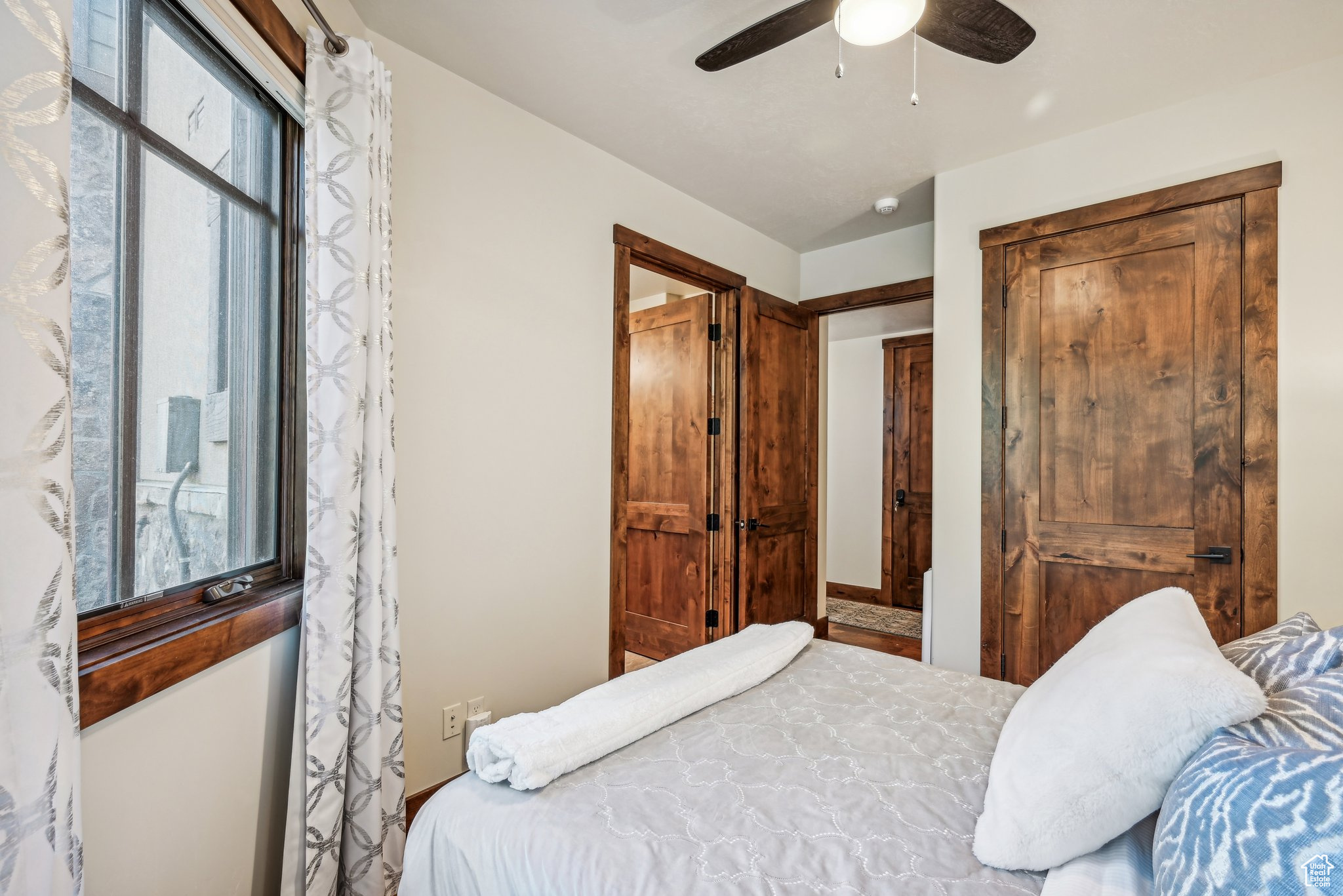 Bedroom featuring ceiling fan and vaulted ceiling